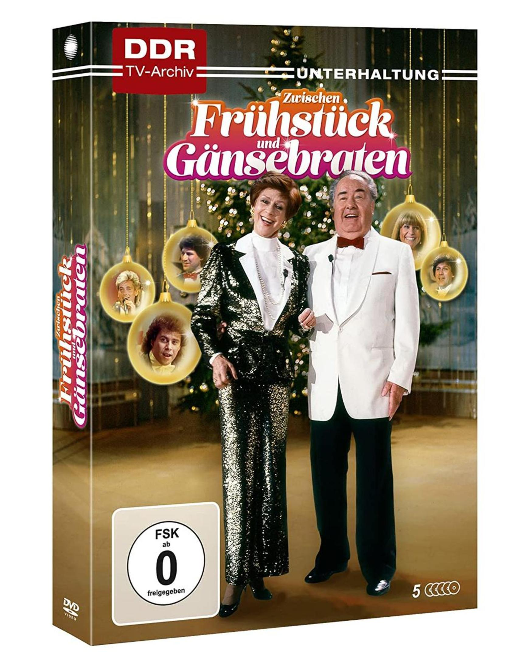 DVD-Cover mit zwei älteren Moderatoren und weihnachtlichen Ornamenten vor einem Baum.