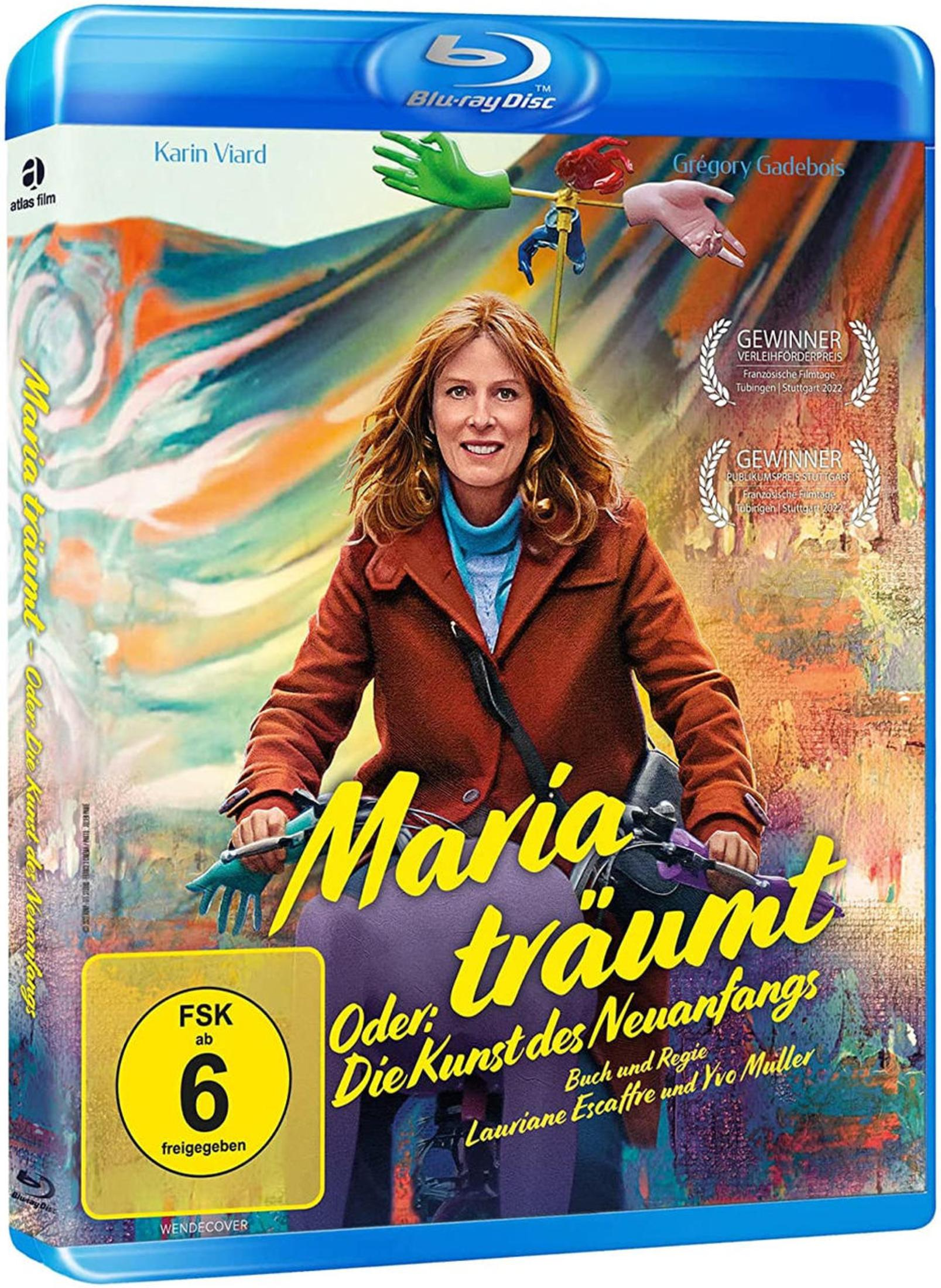 Ein Blu-ray-Cover zeigt eine lächelnde rothaarige Frau auf einem Fahrrad vor buntem Hintergrund.