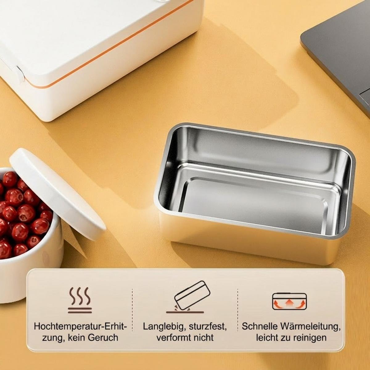 Eine offene Edelstahl-Lunchbox auf beiger Oberfläche mit deutschen Funktionsbeschreibungen.