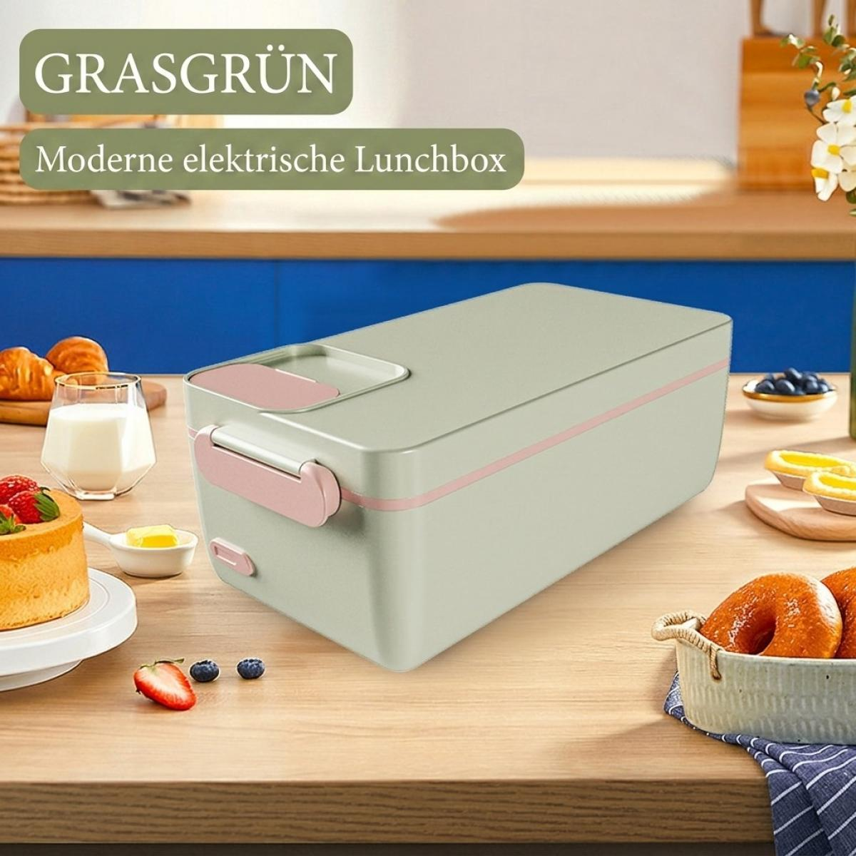 Eine grüne elektrische Lunchbox mit rosa Akzenten steht auf einem Holztisch, umgeben von Lebensmitteln.