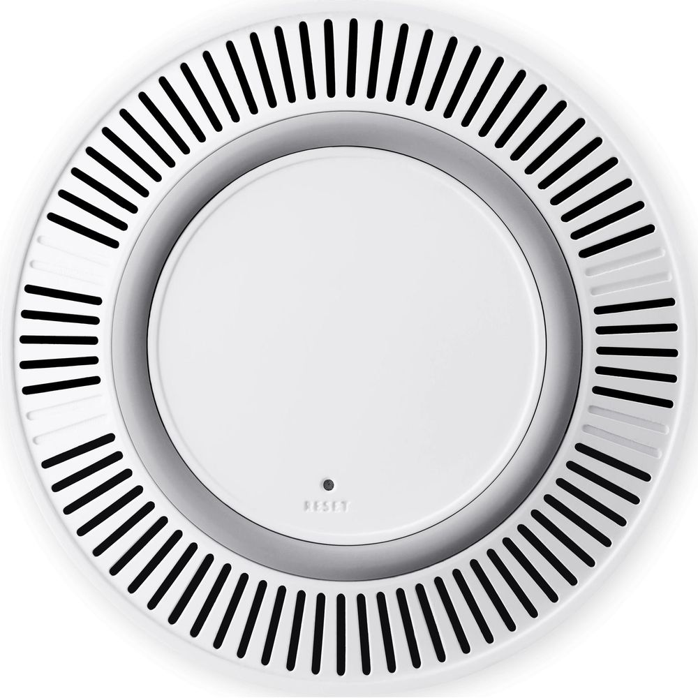 Ein weißer, runder Rauchmelder mit Lüftungsschlitzen am Rand und einer kleinen Reset-Taste.