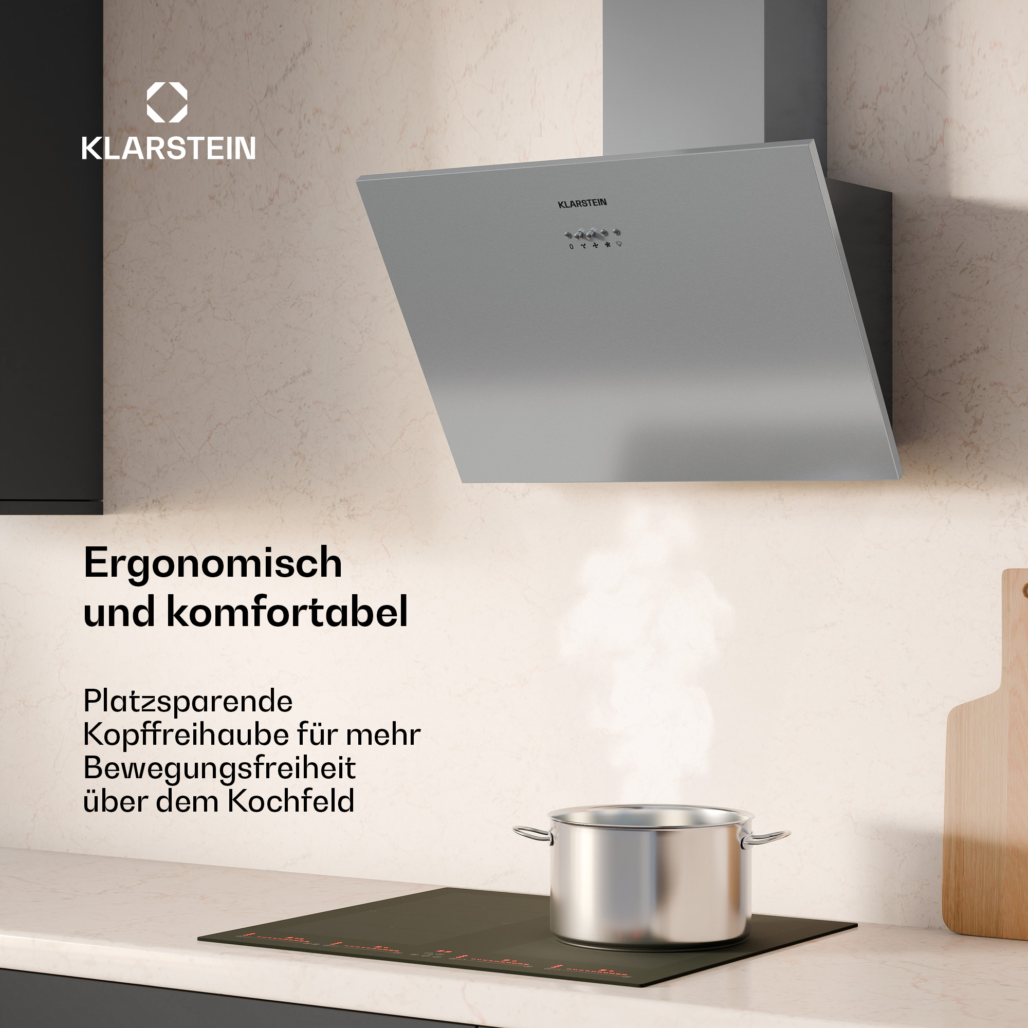 Moderne graue Dunstabzugshaube über einem Kochfeld mit einem dampfenden Topf in einer hellen Küche.