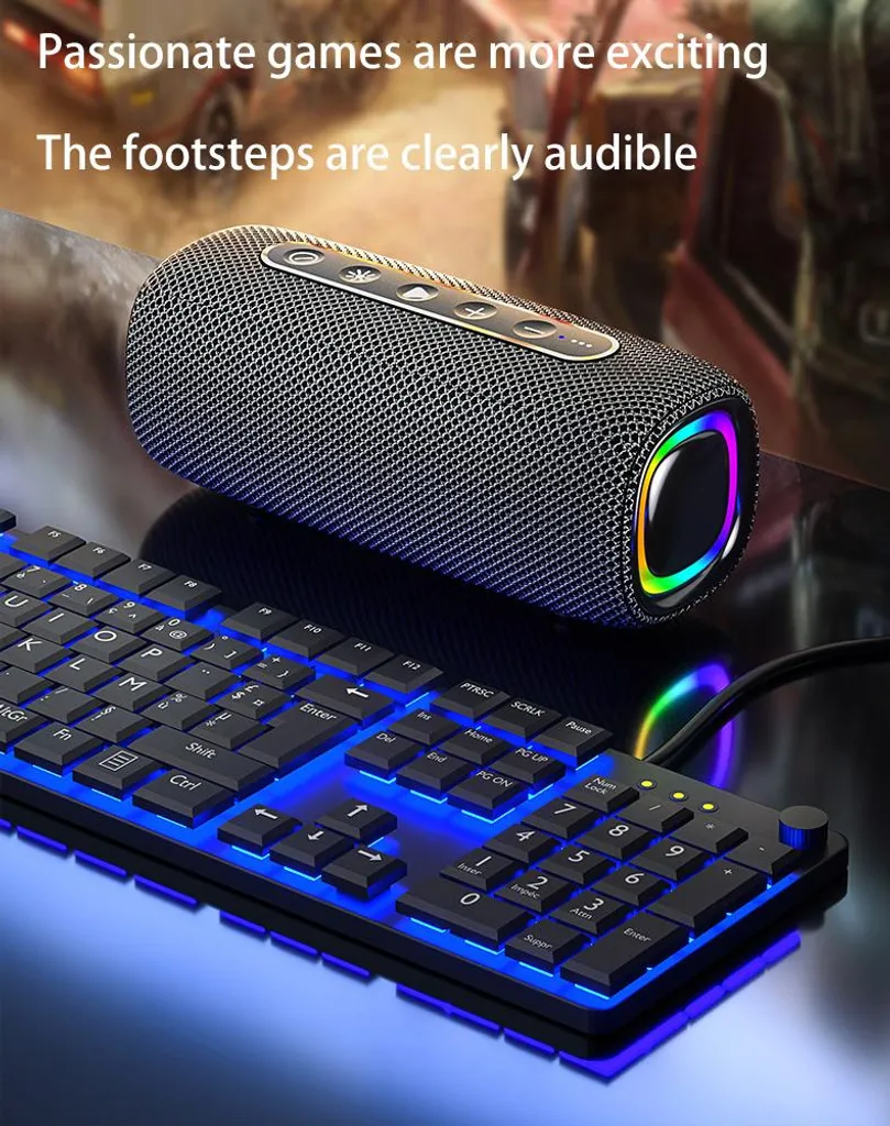 Ein zylindrischer Bluetooth-Lautsprecher mit RGB-Beleuchtung und eine blau beleuchtete Gaming-Tastatur auf dem Tisch.