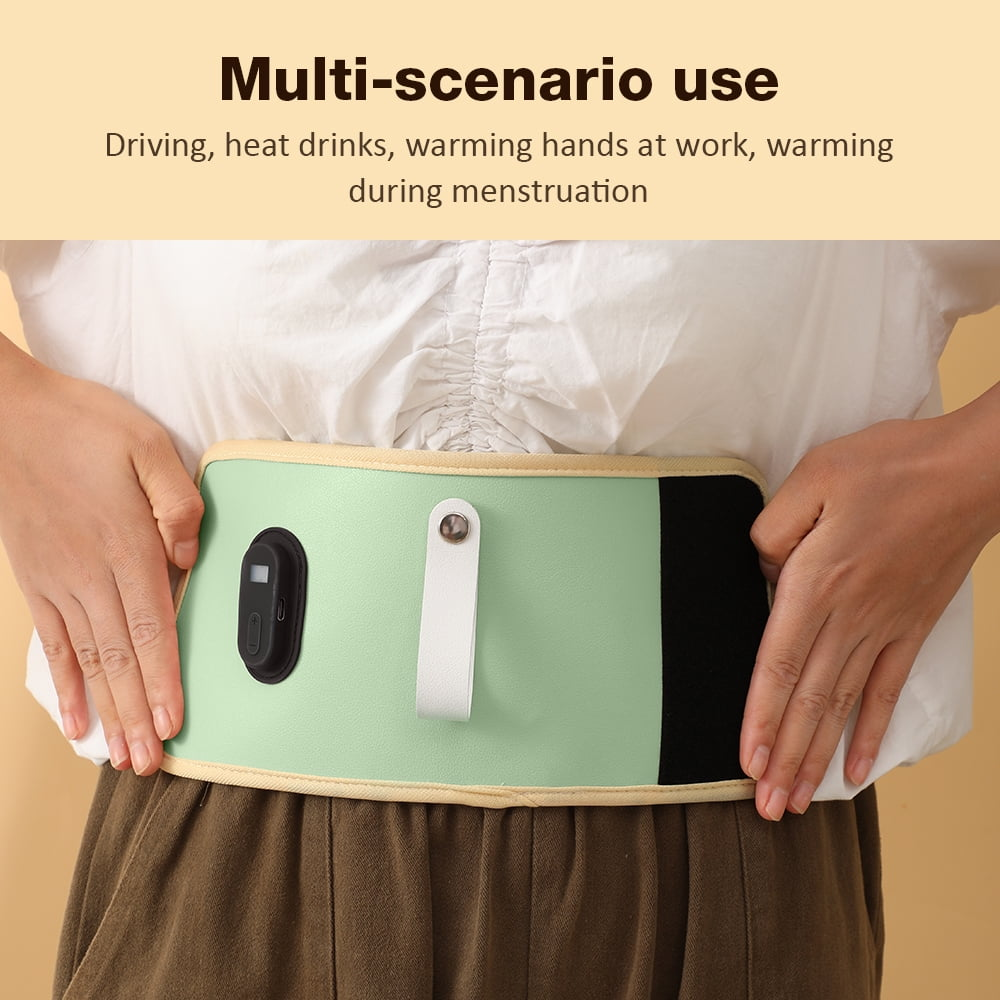 Eine Person trägt einen mintgrünen Heizgürtel um die Taille, mit digitalem Display und weißem Verschluss.