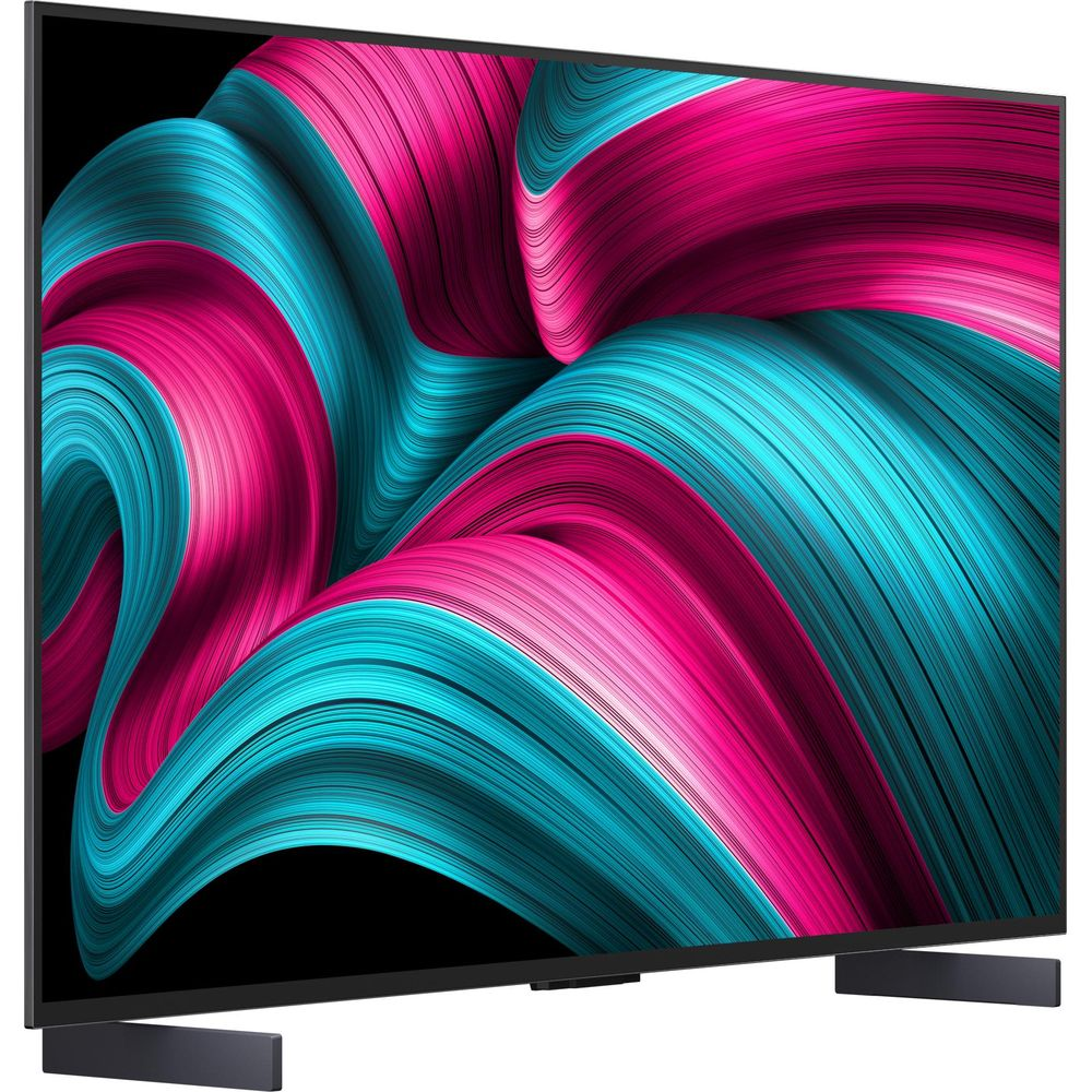TV a schermo piatto che mostra un colorato screensaver astratto con linee rosa e turchesi.