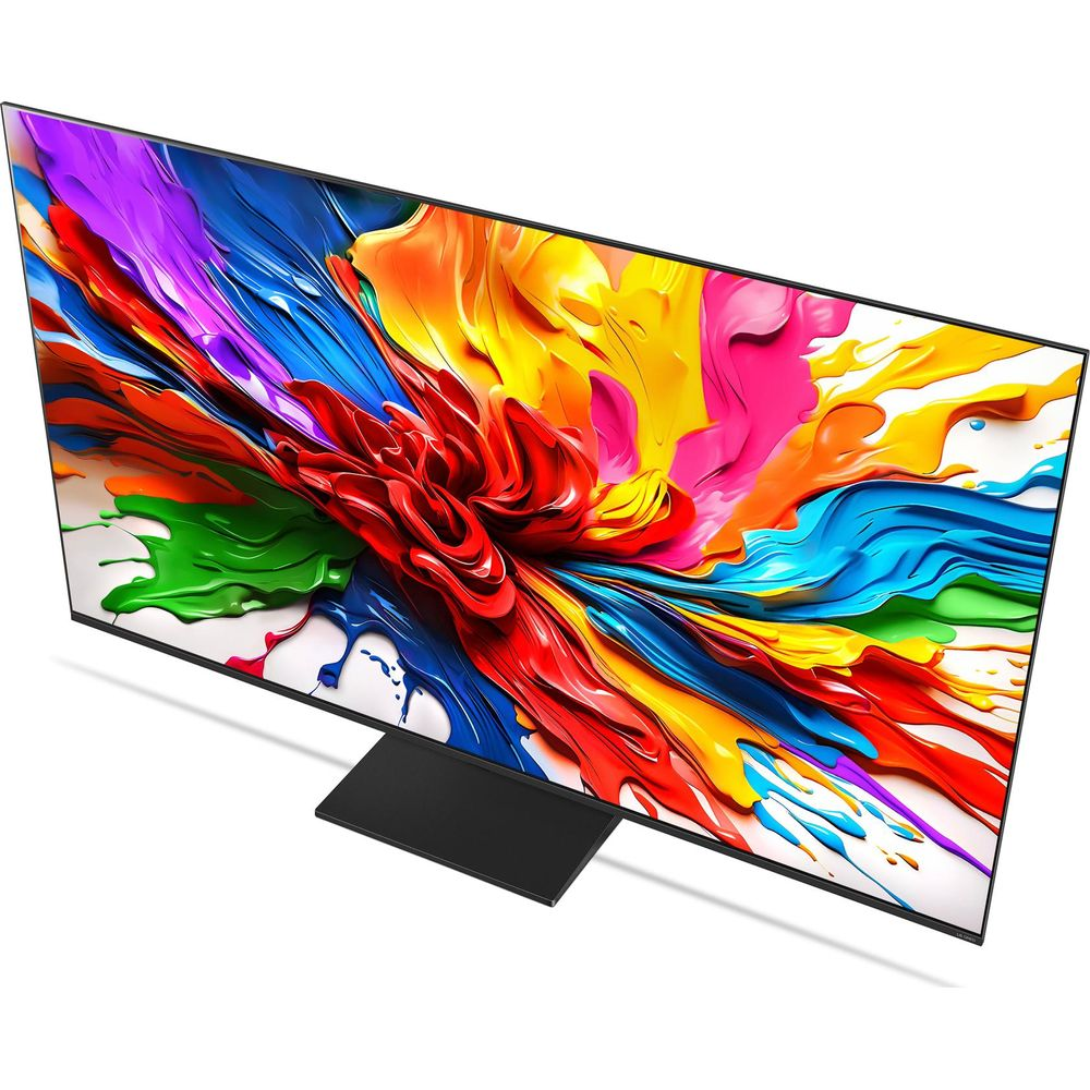 Un téléviseur moderne sur pied noir affiche une éclaboussure de peinture abstraite et colorée sur fond blanc.