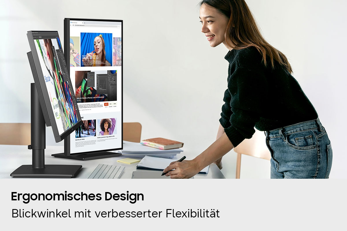 Eine Frau arbeitet an einem Schreibtisch mit zwei vertikalen Monitoren und zeichnet auf einem Grafiktablett.