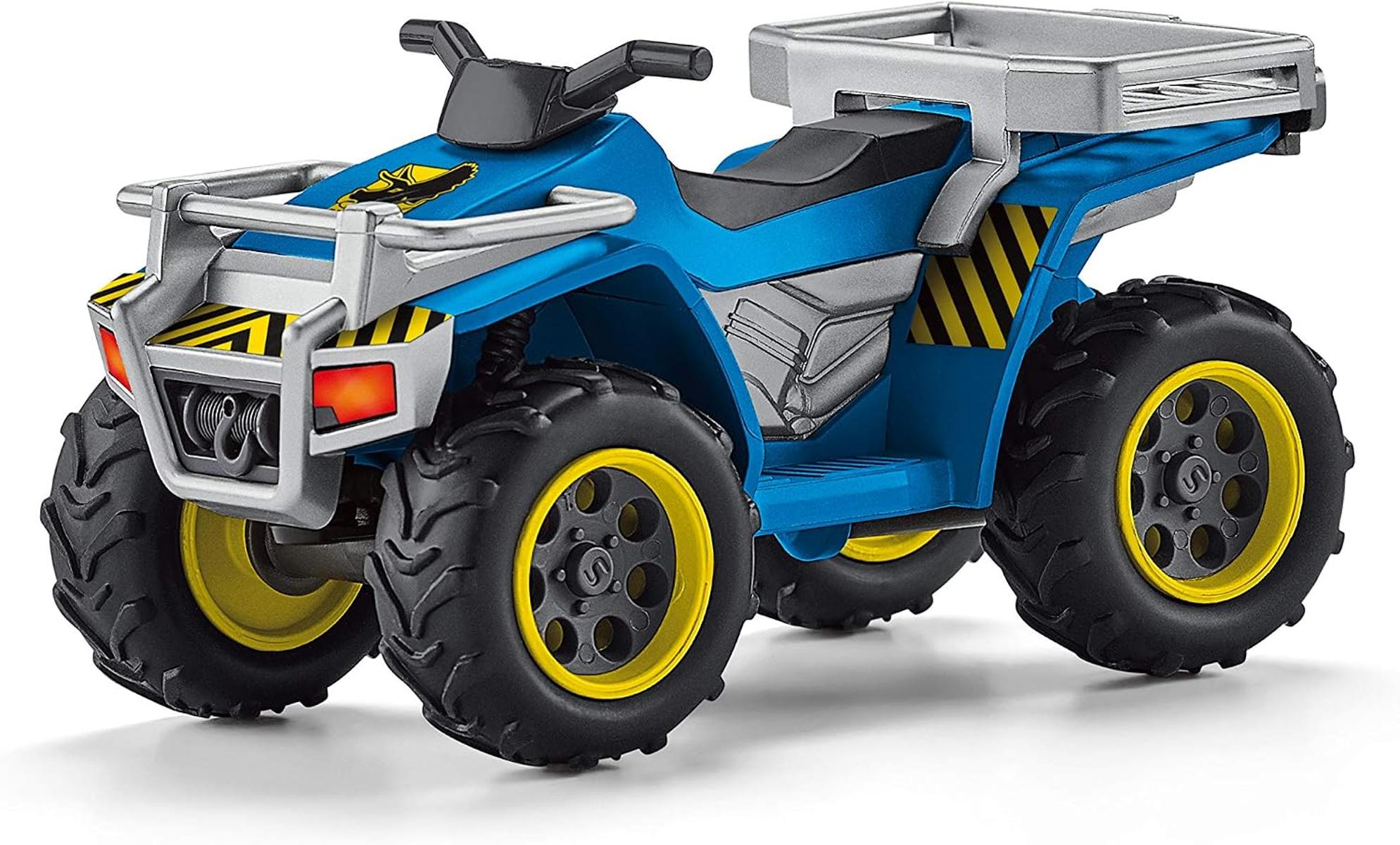 Ein blaues Spielzeug-Quad mit silbernen Gepäckträgern, gelb gerandeten schwarzen Reifen und schwarzem Lenker.
