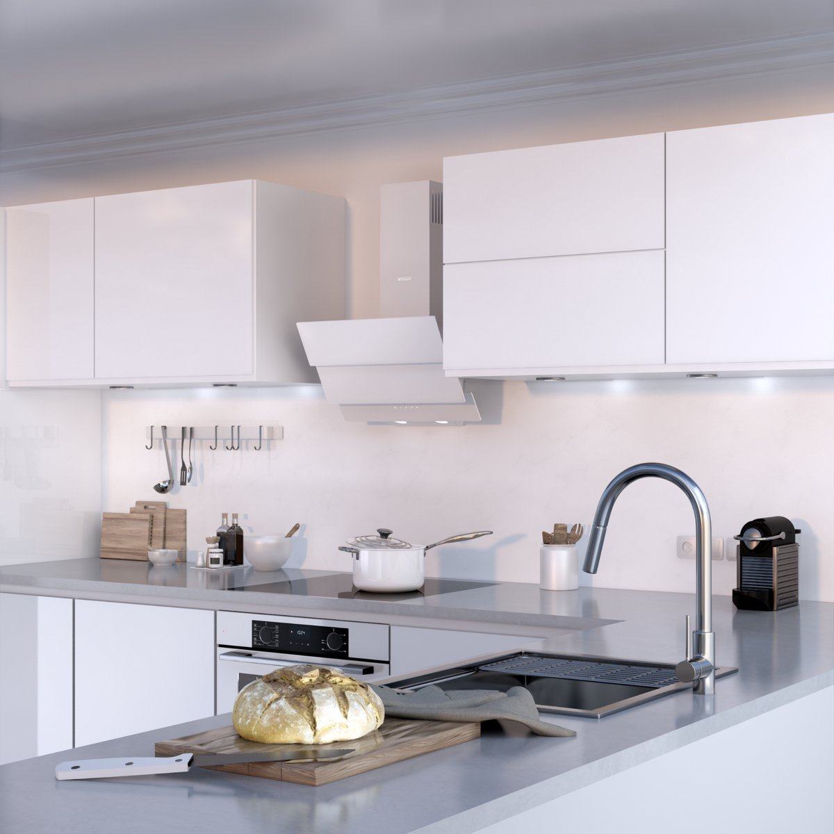 Modern white kitchen with oven, sink, extractor hood, and bread on a cutting board in the foreground.