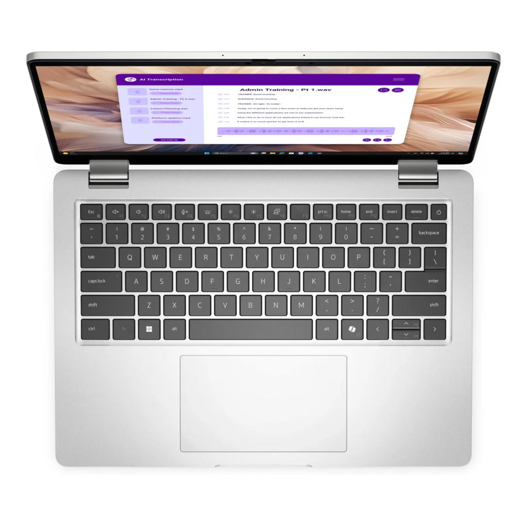 Ekranında açık bir yazılım ve QWERTY klavyesi bulunan gümüş renkli bir dizüstü bilgisayarın üstten görünümü.