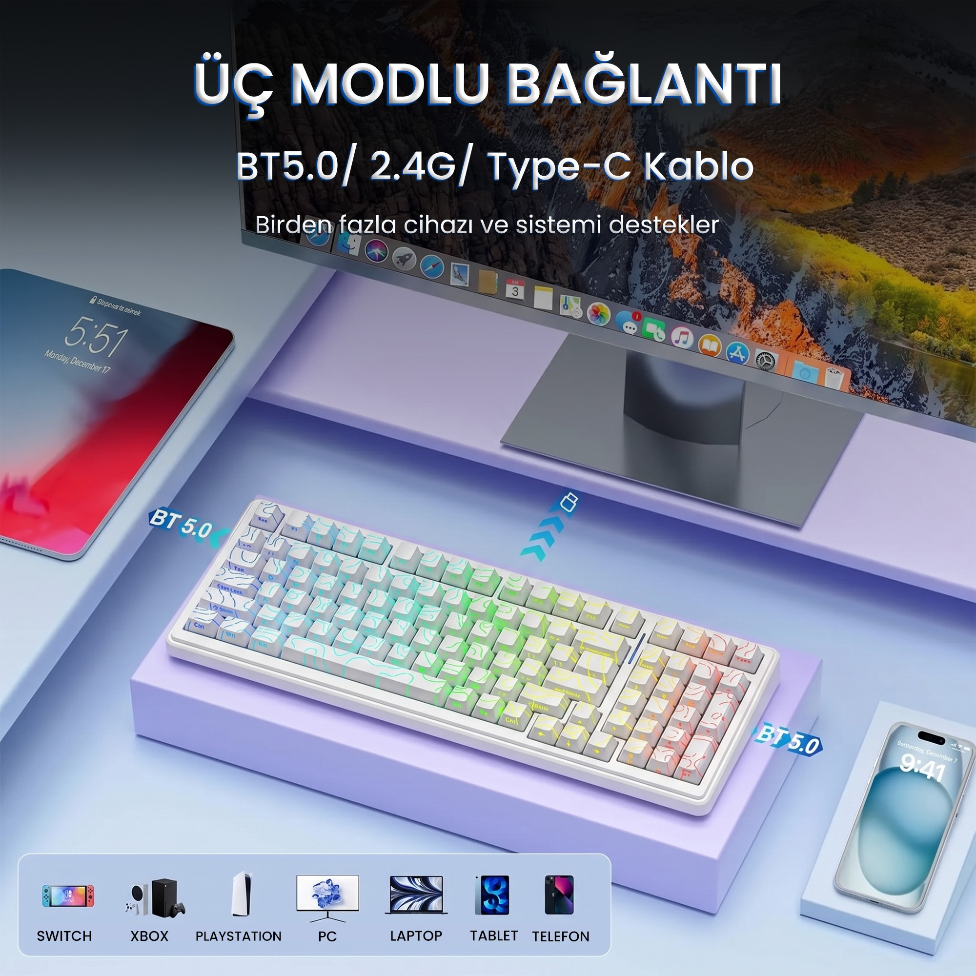Mor masa üzerinde monitör, tablet ve akıllı telefonla birlikte beyaz ve renkli mekanik klavye.