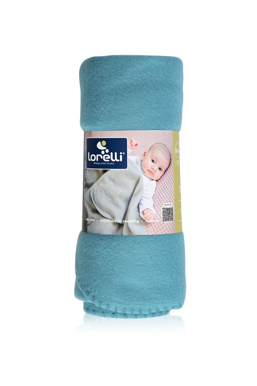 Aufgerollte blaue Babydecke mit einer Papierbanderole, die ein Baby zeigt.