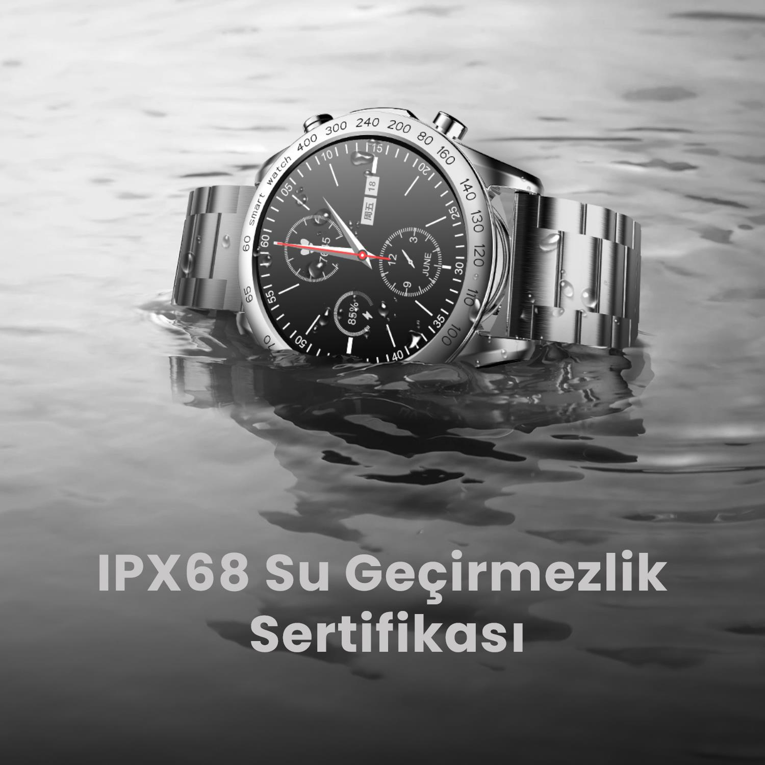 A silver smartwatch with black dial rests partially underwater on a grey surface.