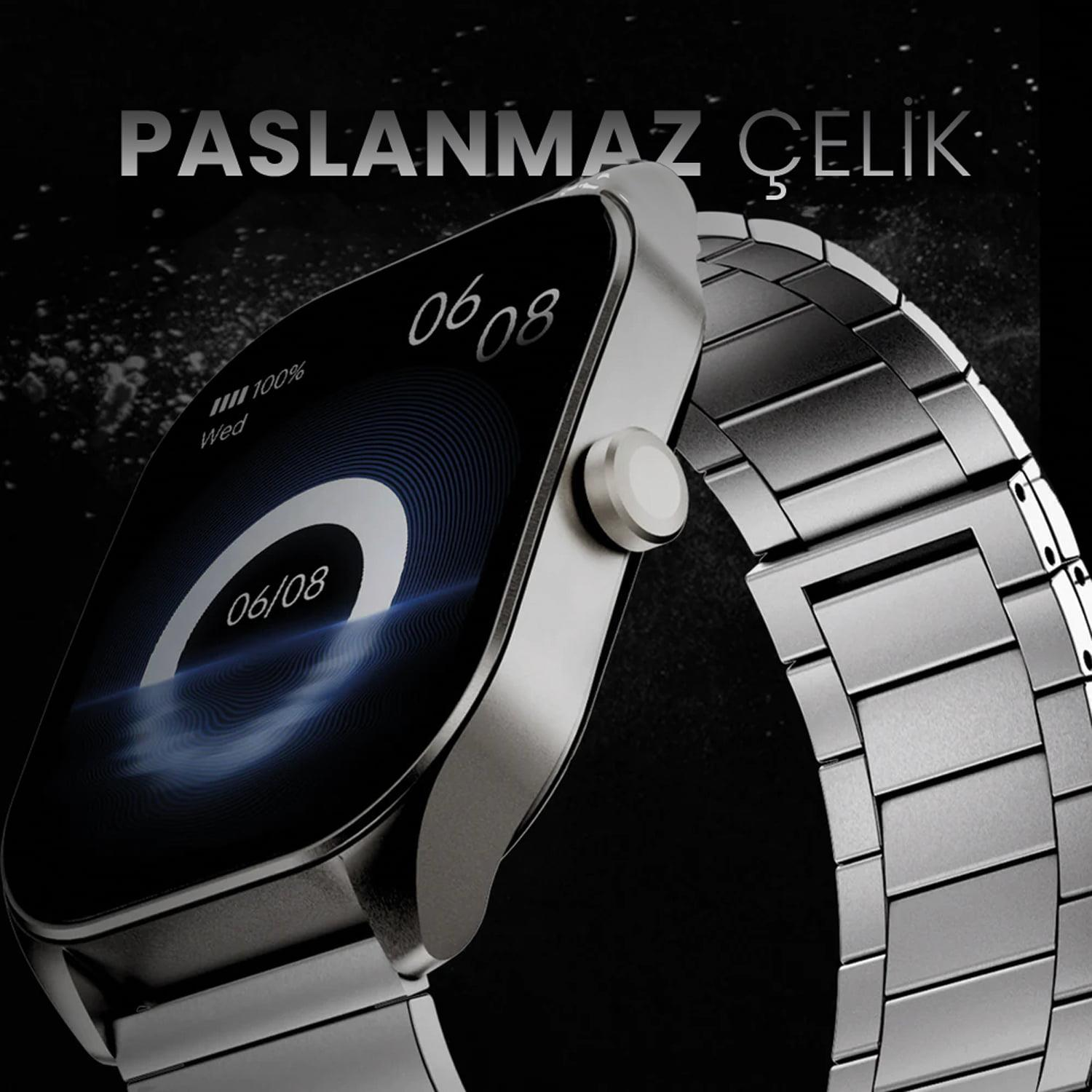 Stainless steel smartwatch with a rectangular display and metal band against a dark background.