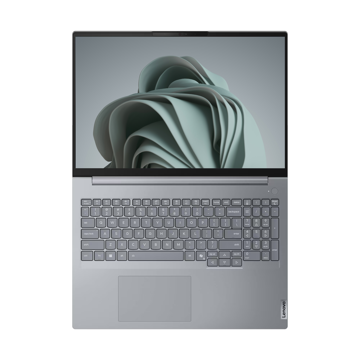 Yukarıdan görülen gri bir Lenovo dizüstü bilgisayar, klavye ve soyut dalgalı bir ekran arkaplanı.