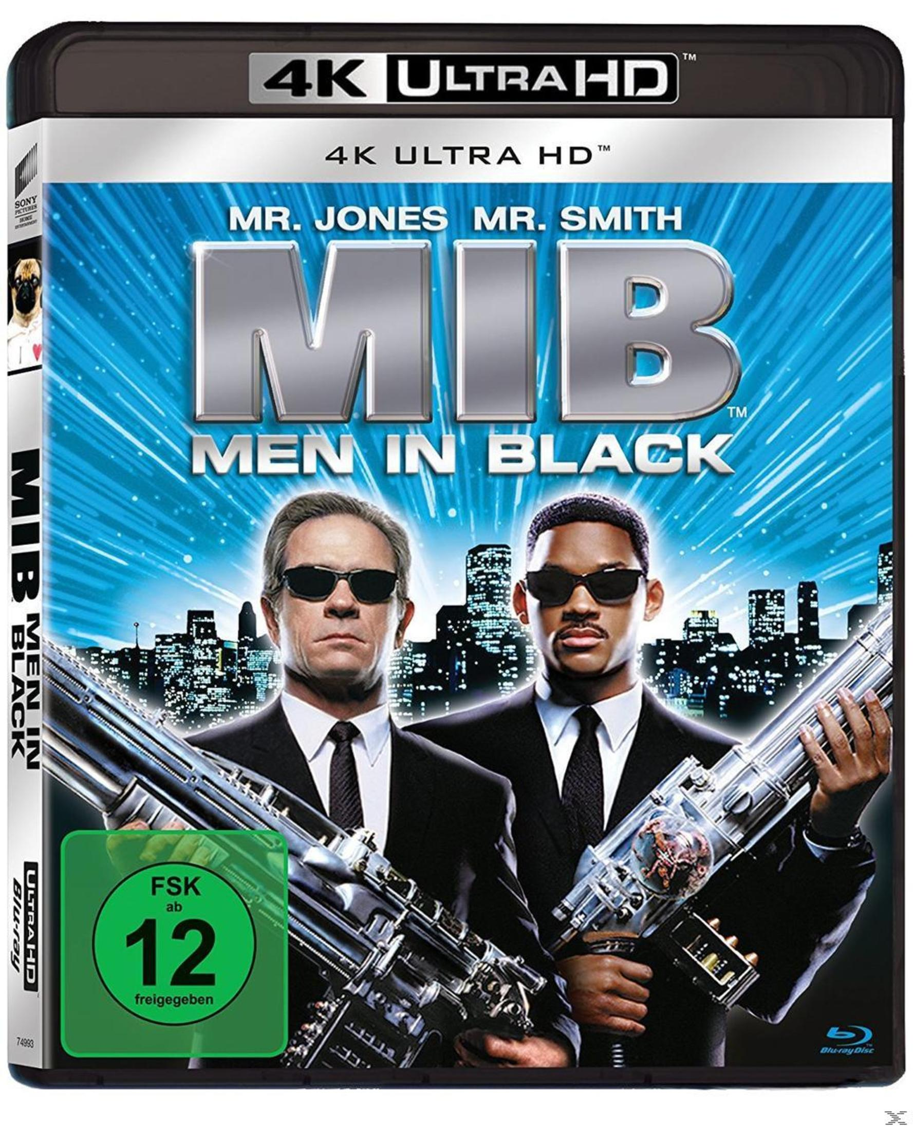 MIB Men in Black 4K Ultra HD Blu-ray-Cover mit zwei Agenten in Anzügen, Sonnenbrillen und großen Waffen.