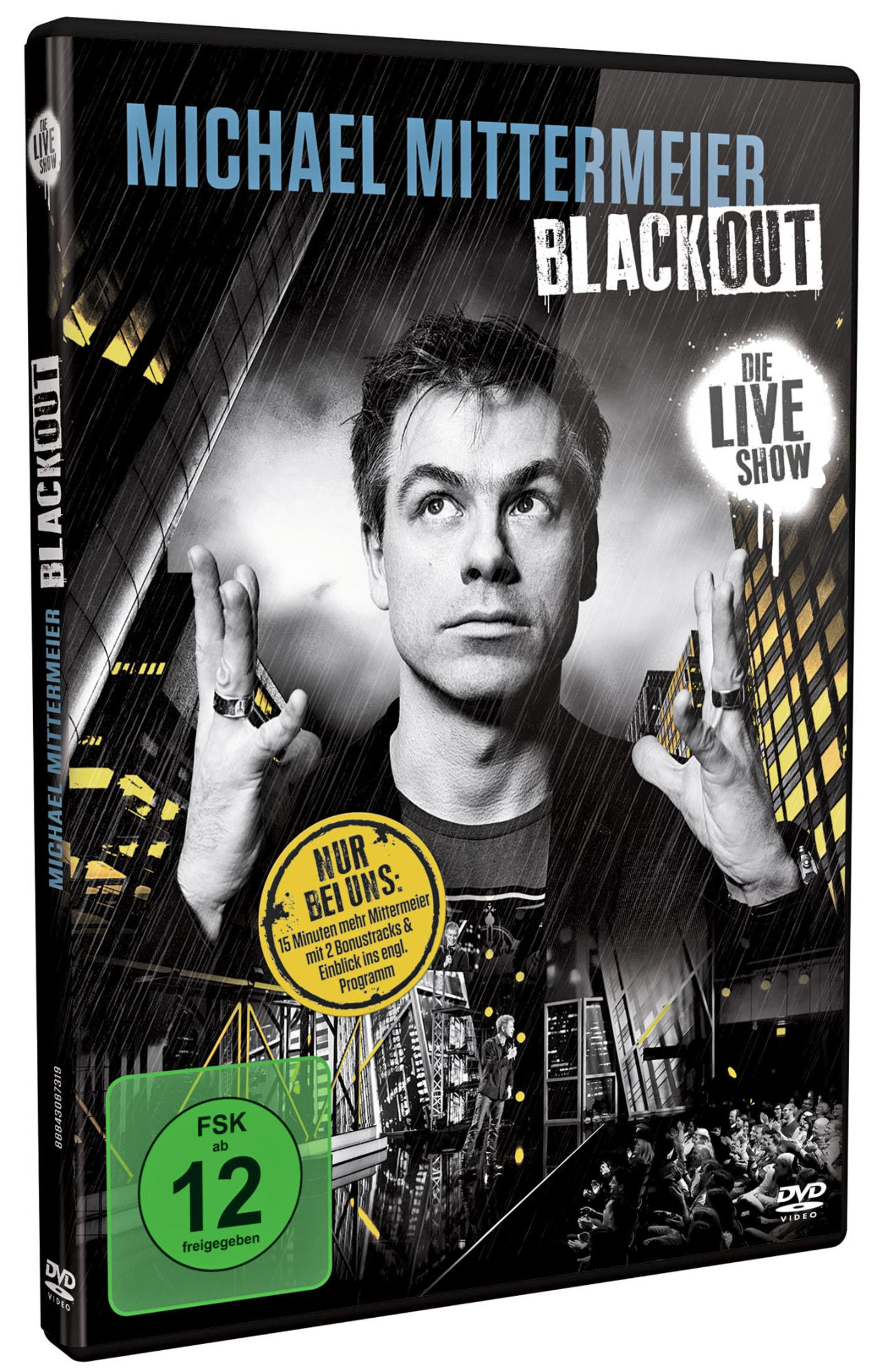 DVD-Cover für Michael Mittermeiers Blackout-Show mit einem Porträt des Comedians und einer Stadtwilidade.