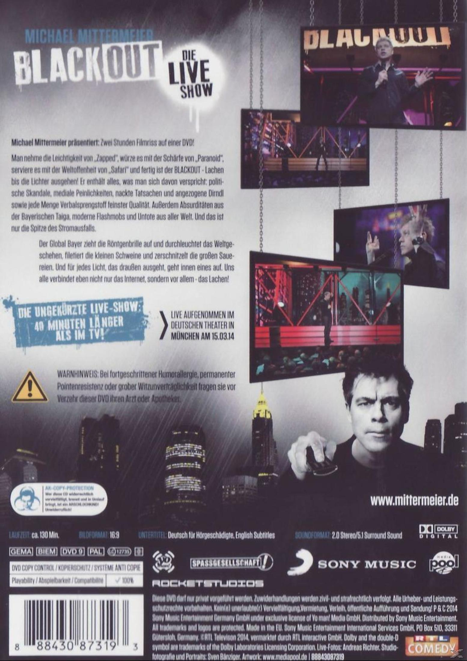 Rückseite einer Michael Mittermeier Live-DVD mit Texten, Szenenfotos und Logos.