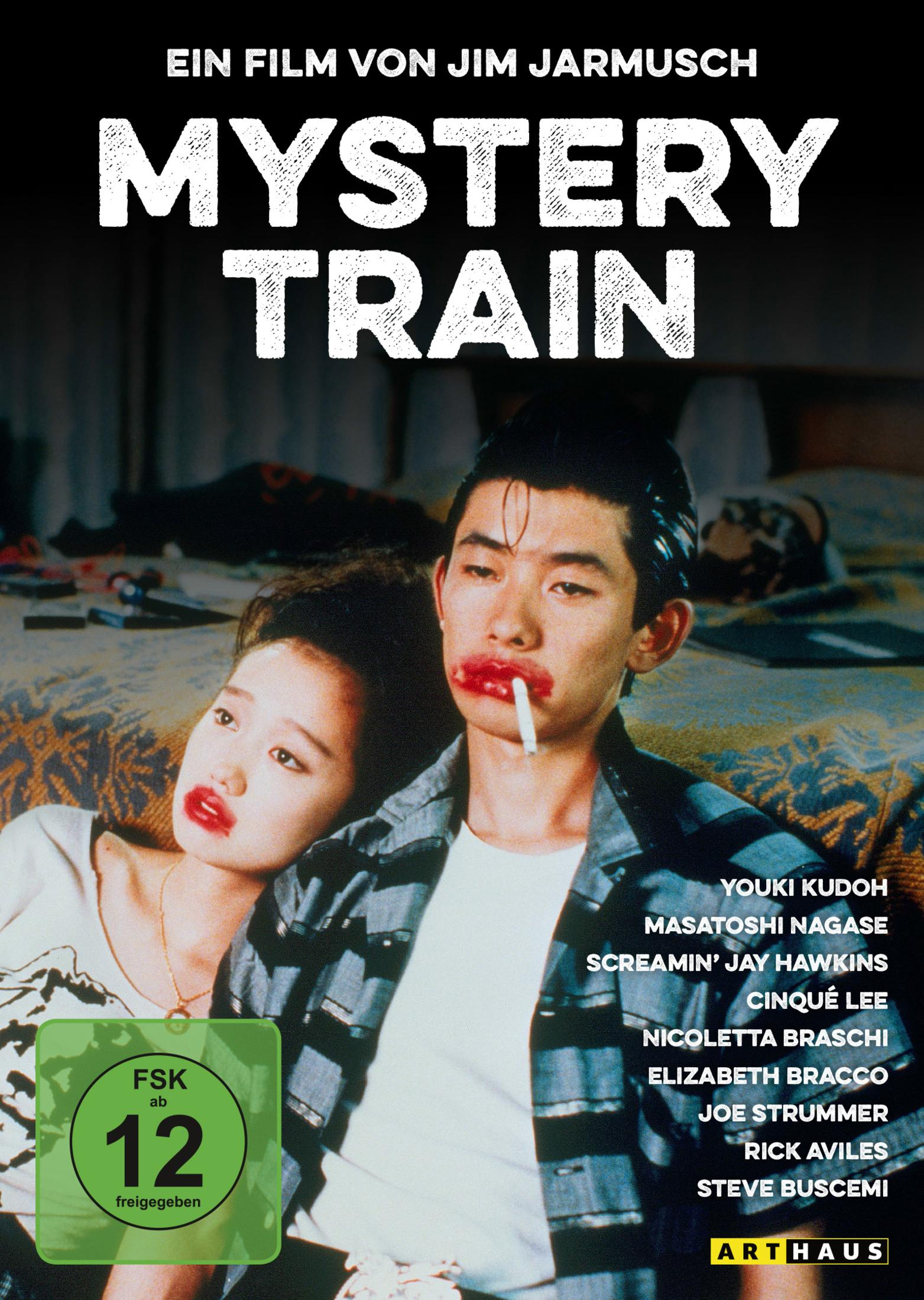 Mystery Train Filmposter zeigt junges Paar mit dickem Lippenstift und Zigarette auf Bett.