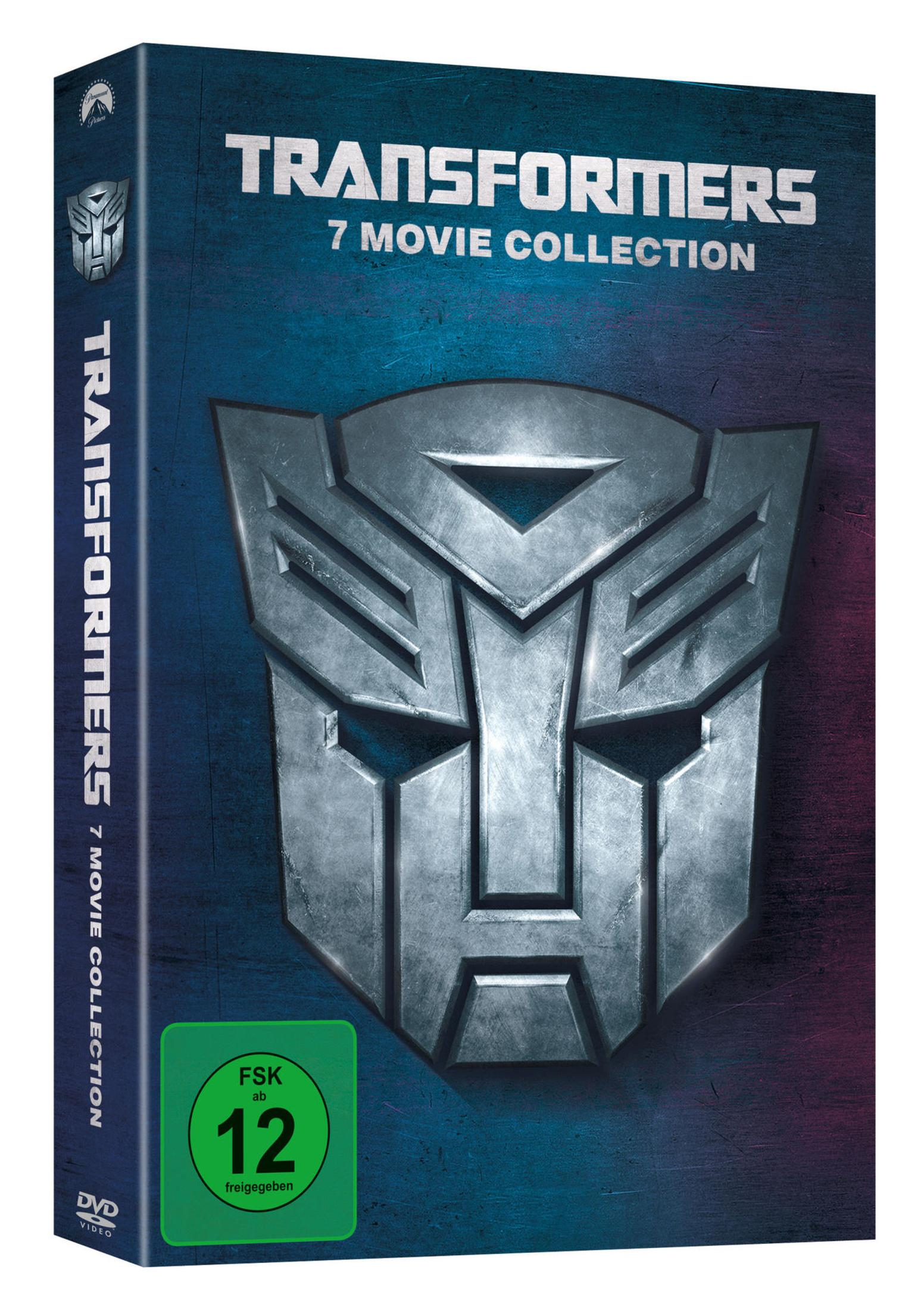 DVD-Box der Transformers 7-Movie Collection mit großer silberner Autobot-Maske auf blau-lila Hintergrund.