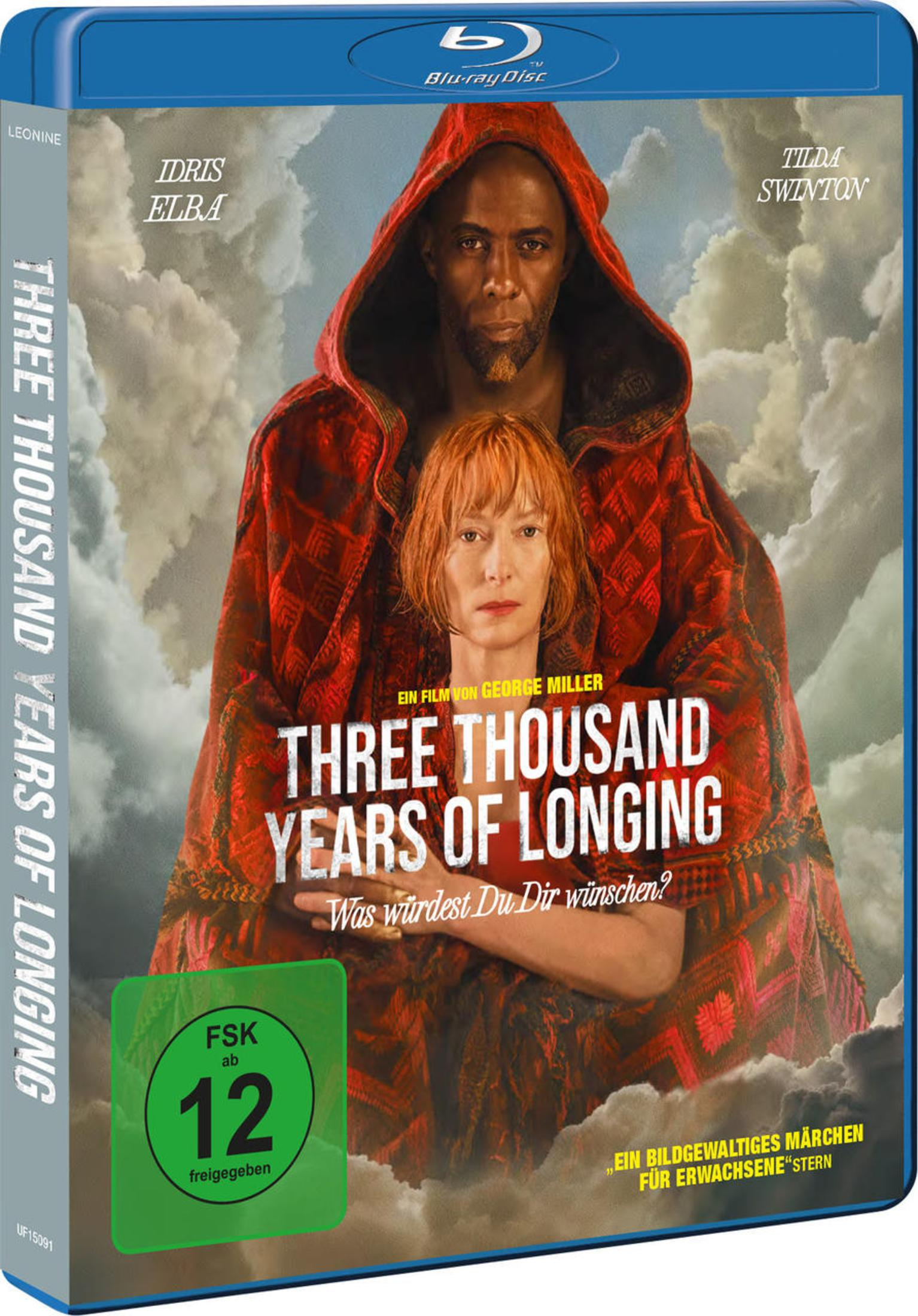 Blu-ray-Cover von Three Thousand Years of Longing mit Idris Elba und Tilda Swinton vor einem bewölkten Himmel.