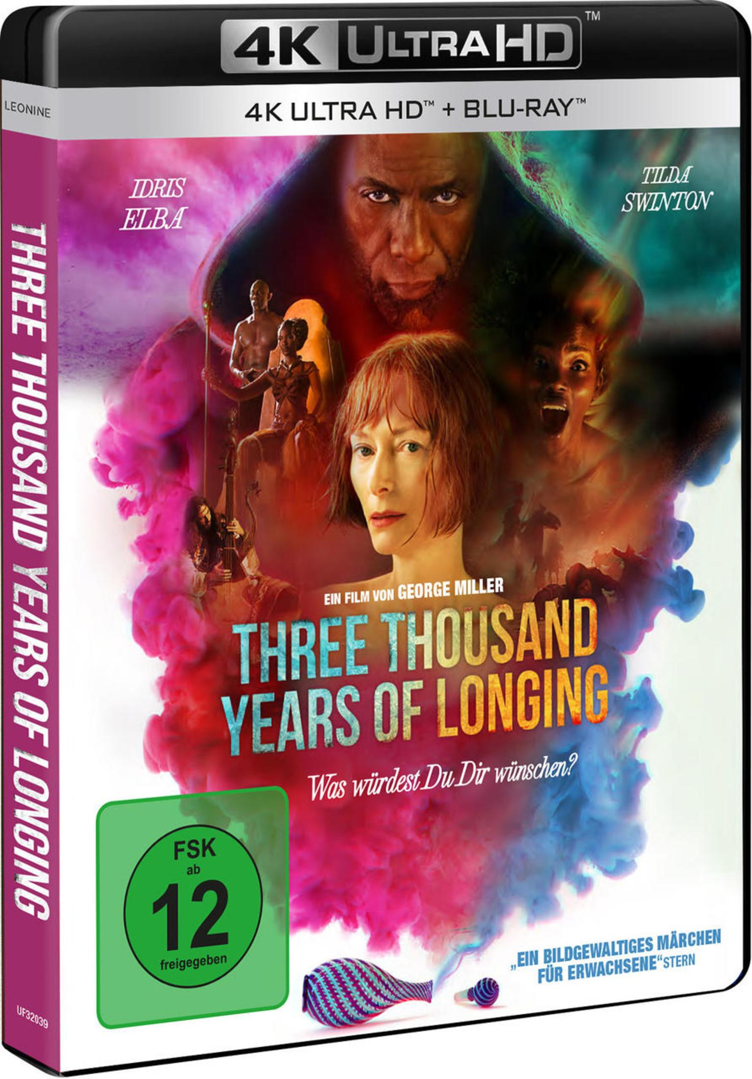Blu-ray-Cover von Three Thousand Years of Longing mit Tilda Swinton und Idris Elba vor farbigem Rauch.