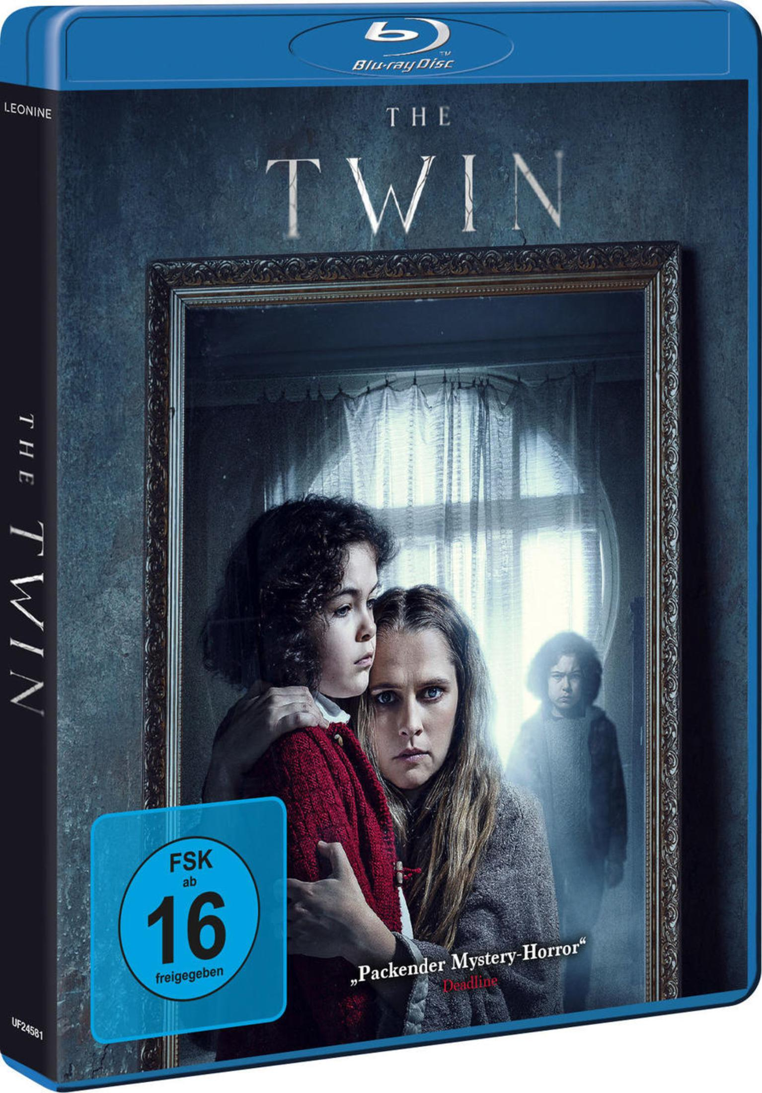 Blu-ray-Hülle von Der Zwilling zeigt eine Frau und ein Kind vor einem Spiegel mit einer unheimlichen Gestalt.