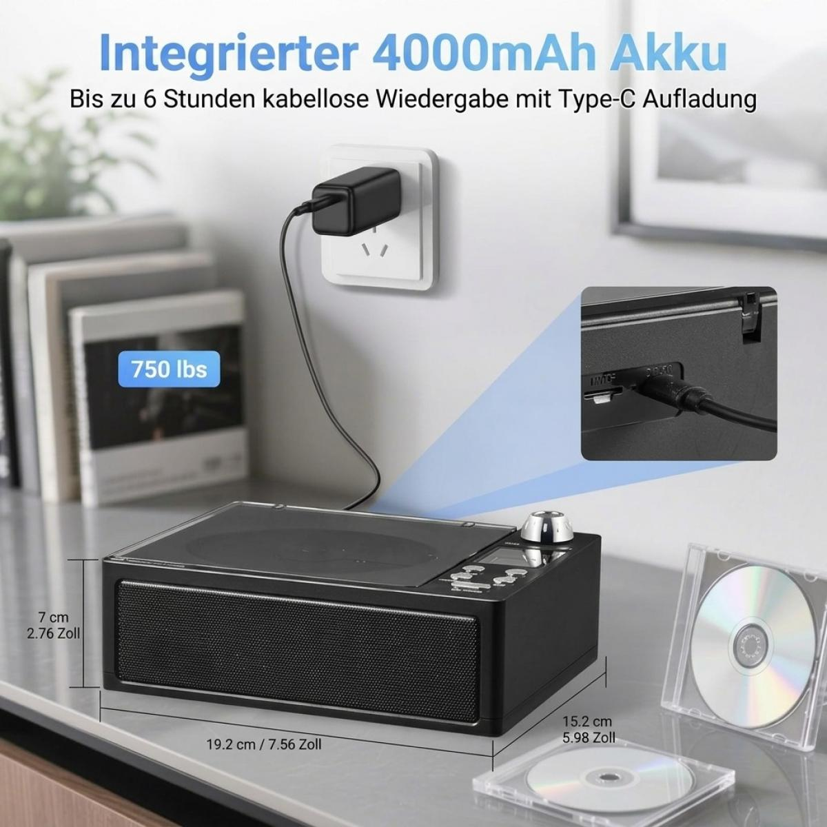 Ein schwarzer CD-Player mit Lautsprechern, Maßen, Ladekabel und CDs auf einem Tisch.