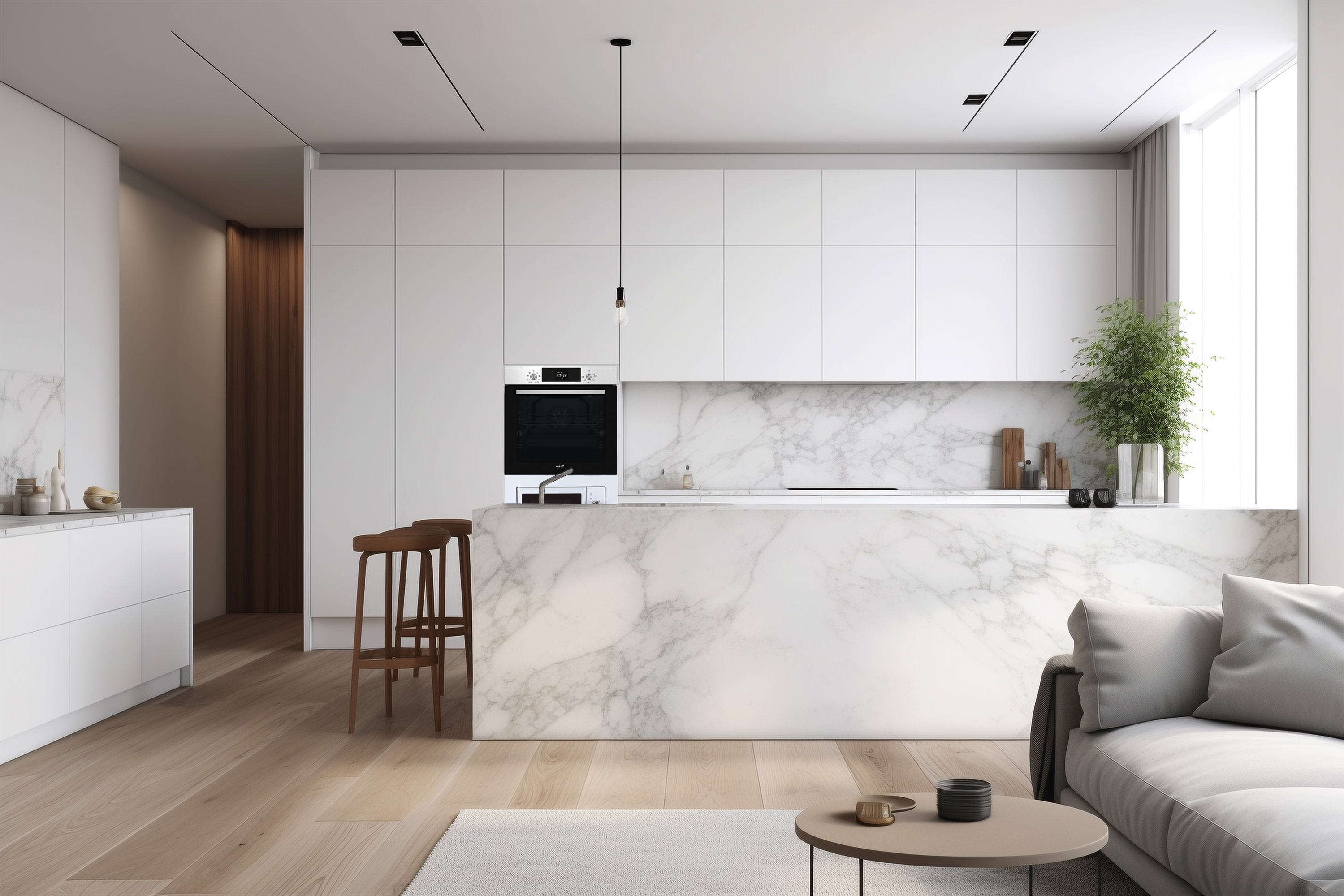 Una cucina moderna ha mobili bianchi, ripiani in marmo, un'isola con sgabelli in legno e un divano in primo piano.