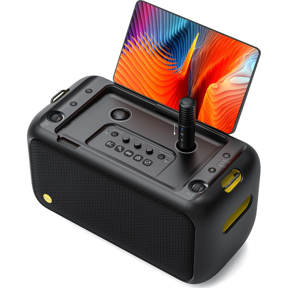 Ein schwarzer tragbarer Karaoke-Lautsprecher mit Mikrofon, Bedienelementen und einem bunten Tablet.