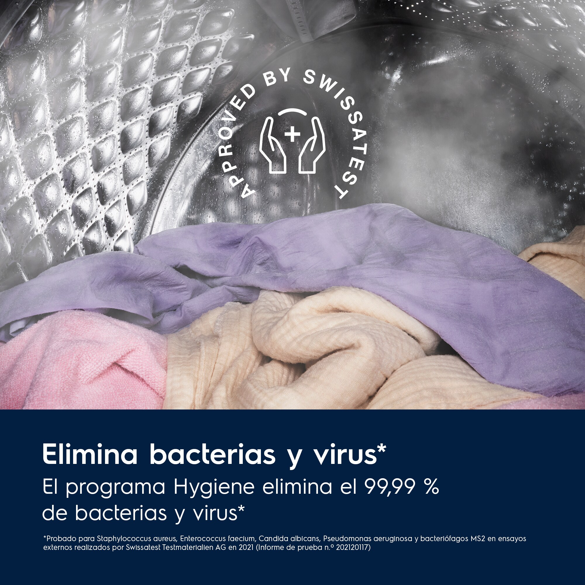 Ropa dentro del tambor de una lavadora con vapor y el texto 'Elimina bacterias y virus'.