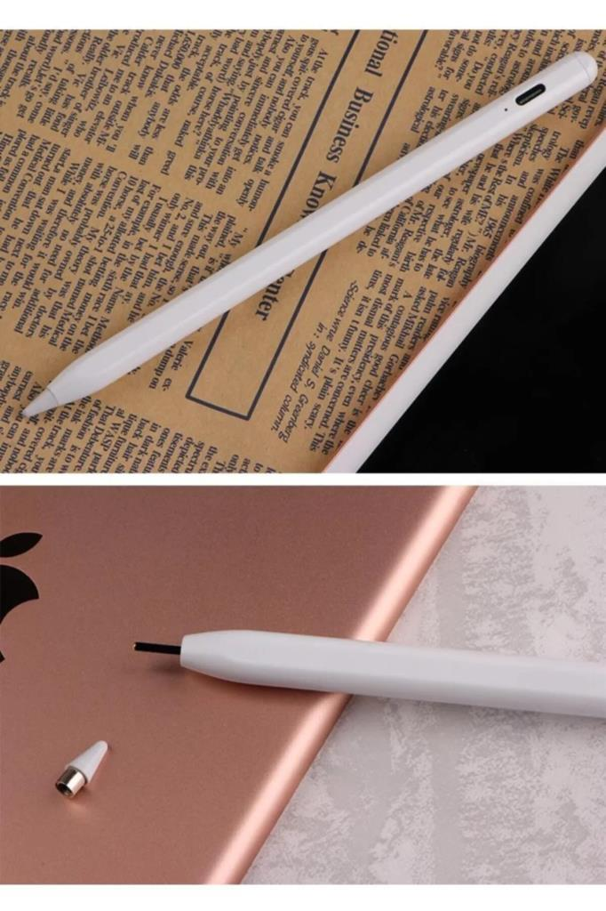 Beyaz bir kalem gazete üzerinde çapraz duruyor, altta ise bir tablet üstünde küçük bir metal ucun yanında.