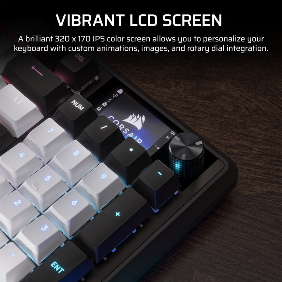 Una tastiera con schermo LCD vibrante, logo Corsair e manopola su legno scuro.