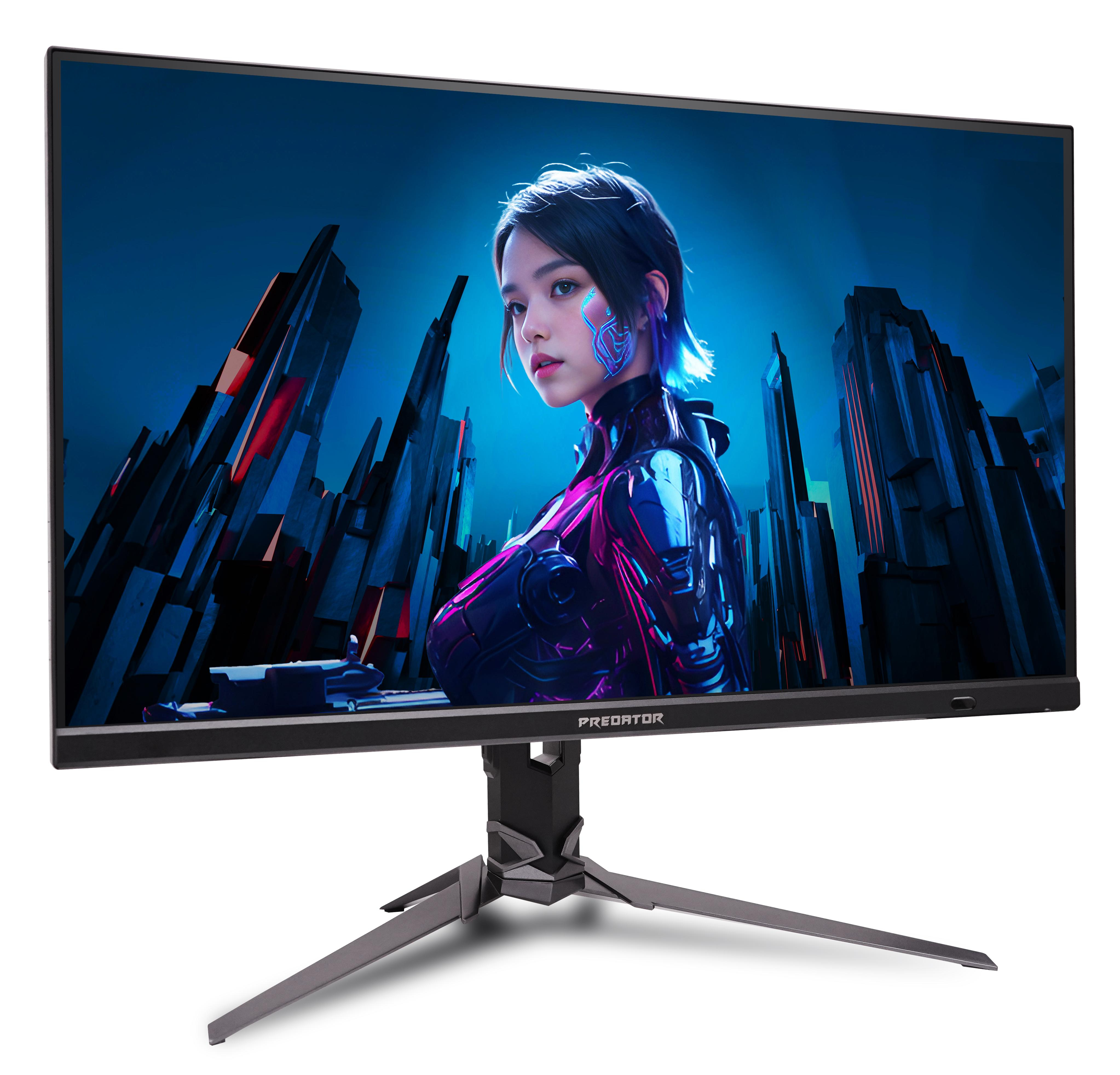 Un monitor da gioco nero mostra una donna cyborg futurista su sfondo di città blu su un supporto.