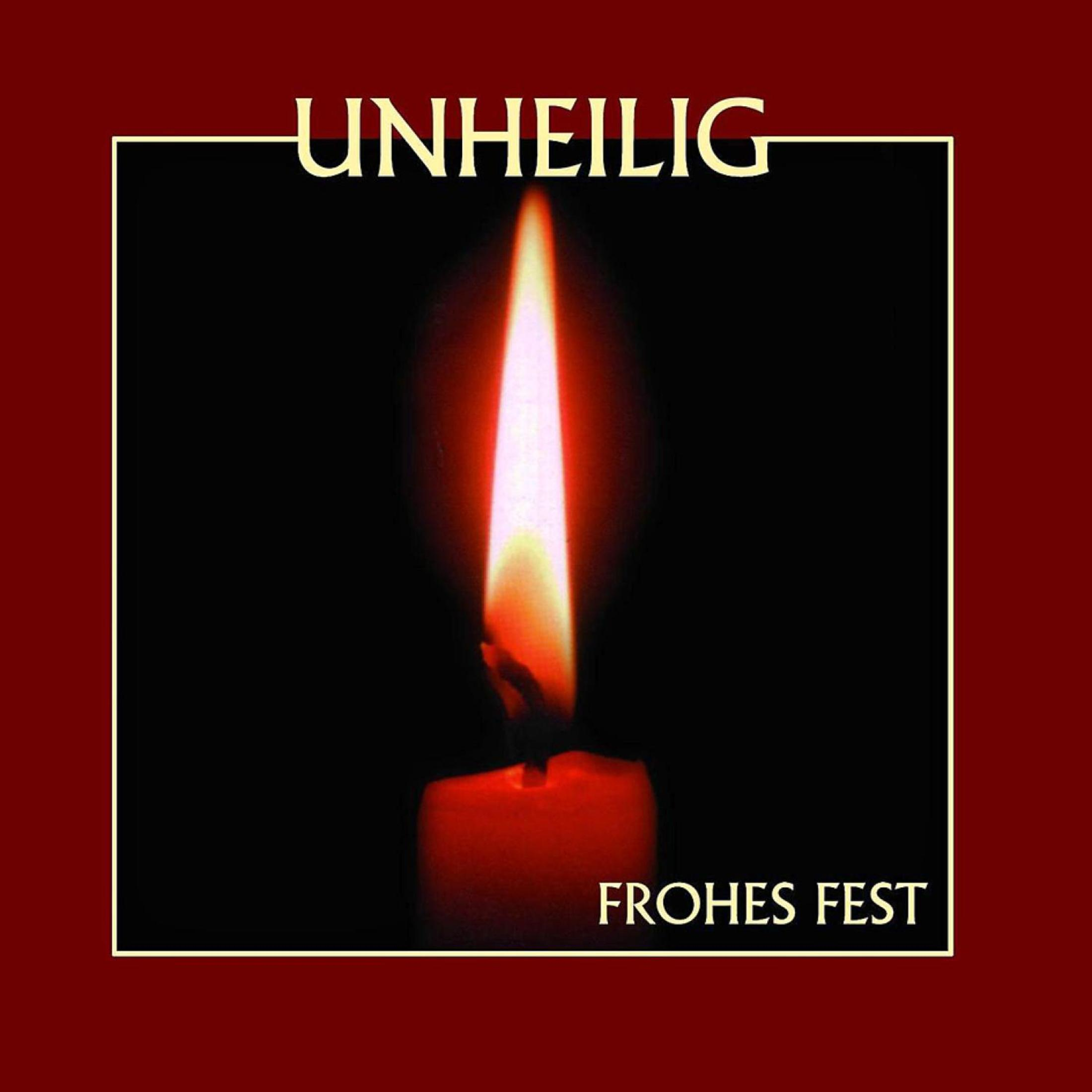 Eine brennende Kerze mit der Aufschrift Unheilig Frohes Fest.
