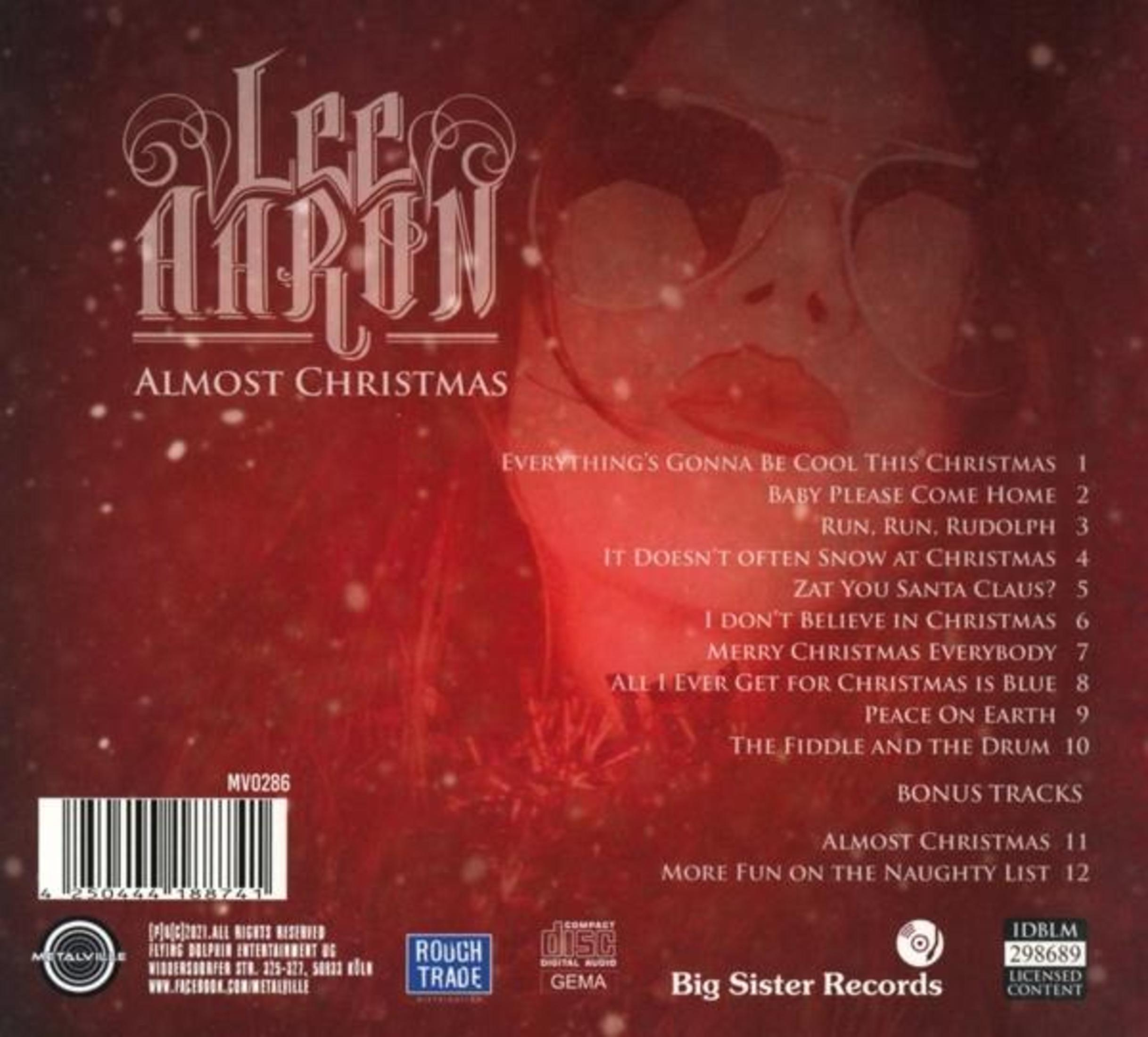 Rückseite des Lee Aaron Albums 'Almost Christmas' mit Tracklist, Barcode und roten Hintergrundgrafiken.