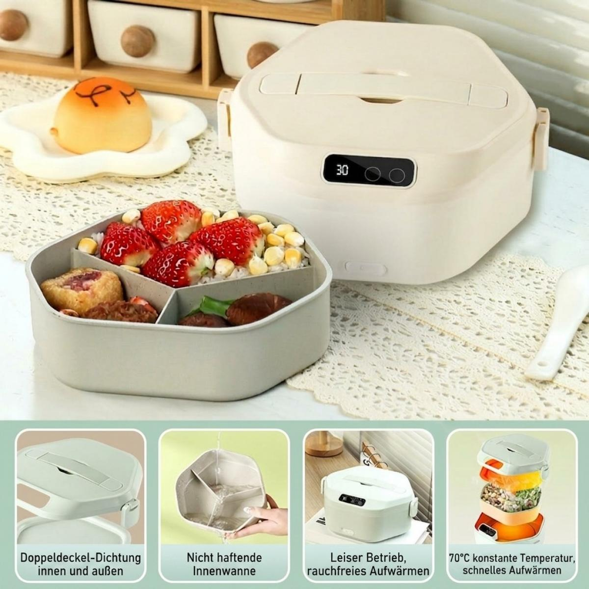 Beige elektrische Lunchbox mit geteiltem Innenbehälter gefüllt mit Erdbeeren, Reis und Snacks auf weißem Tisch.