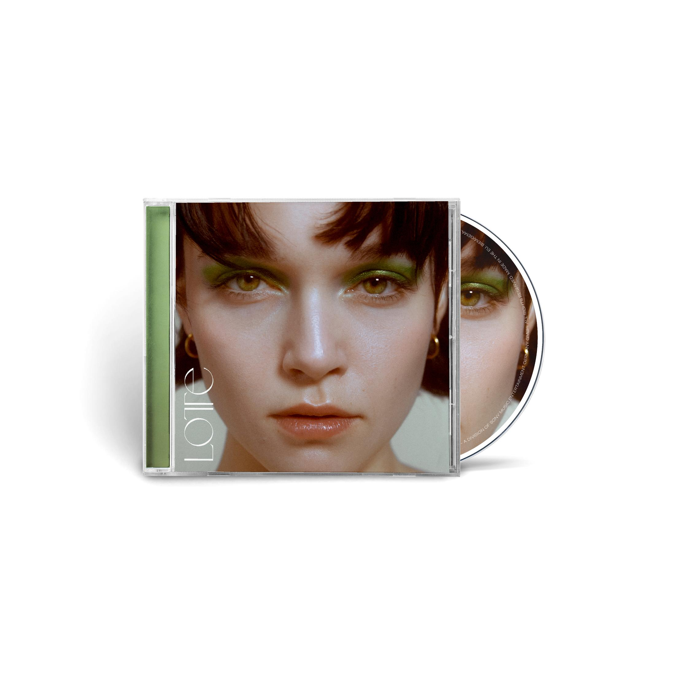 CD-Hülle mit dem Gesicht einer Frau mit grünem Lidschatten und kurzem braunen Haar auf dem Cover.