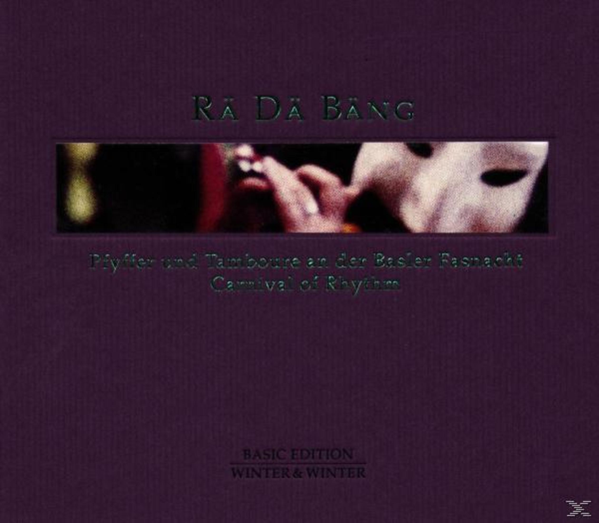 Albumcover mit violettem Hintergrund, Text Ra Da Bang und einem Bild einer maskierten Flötenspielerin.