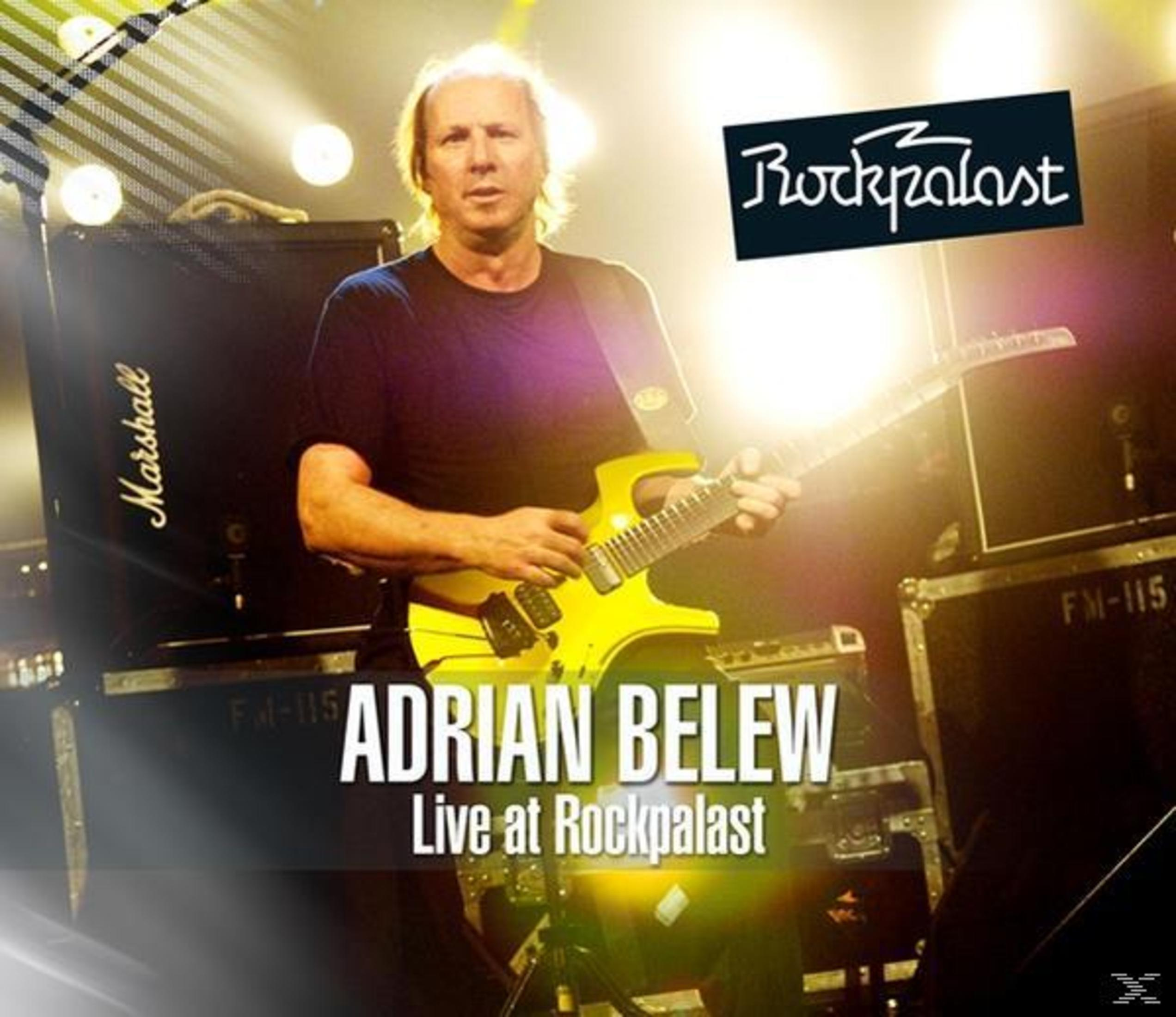 Adrian Belew auf der Bühne mit gelber Gitarre, im Hintergrund Marshall-Verstärker und Rockpalast-Logo.