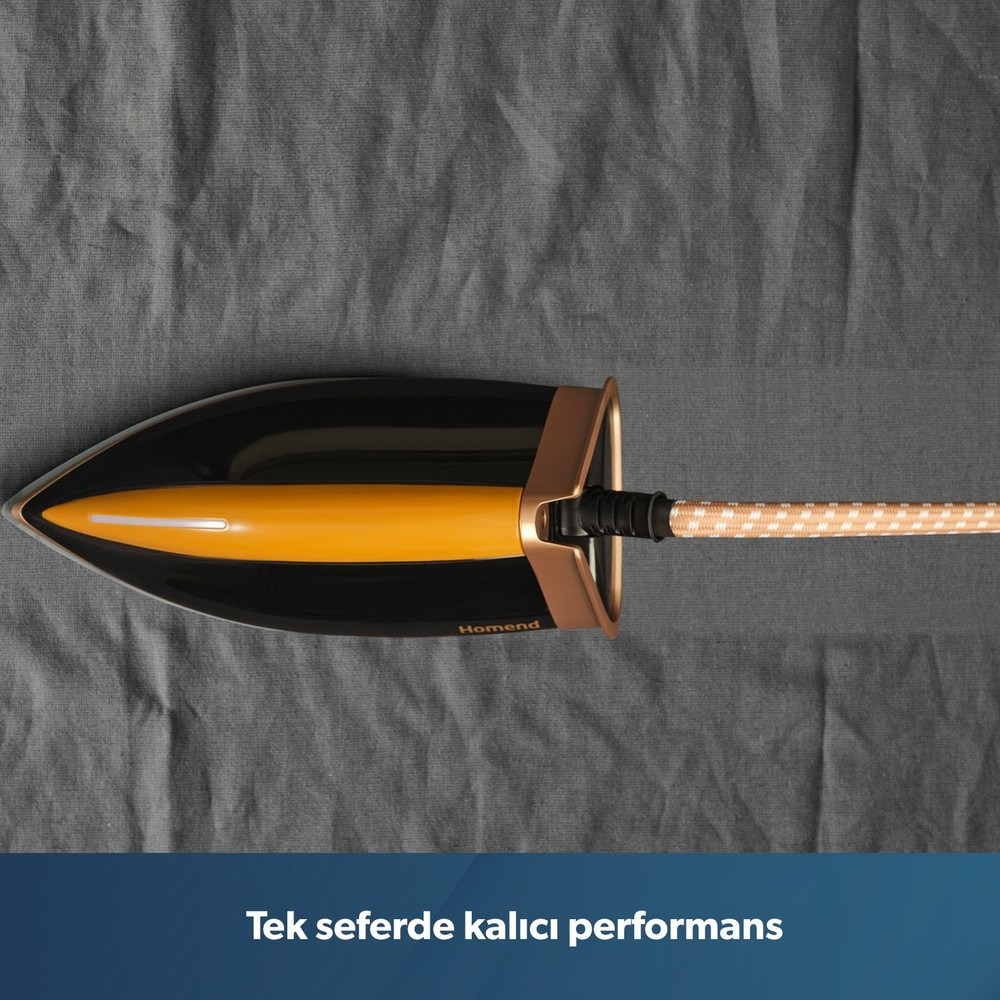 Gri kumaş üzerinde desenli kablosu olan siyah ve sarı renkli Homend ütü.