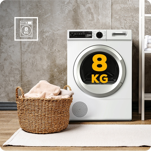 Biała suszarka bębnowa 8 kg stoi obok kosza na pranie na tle betonowej ściany.