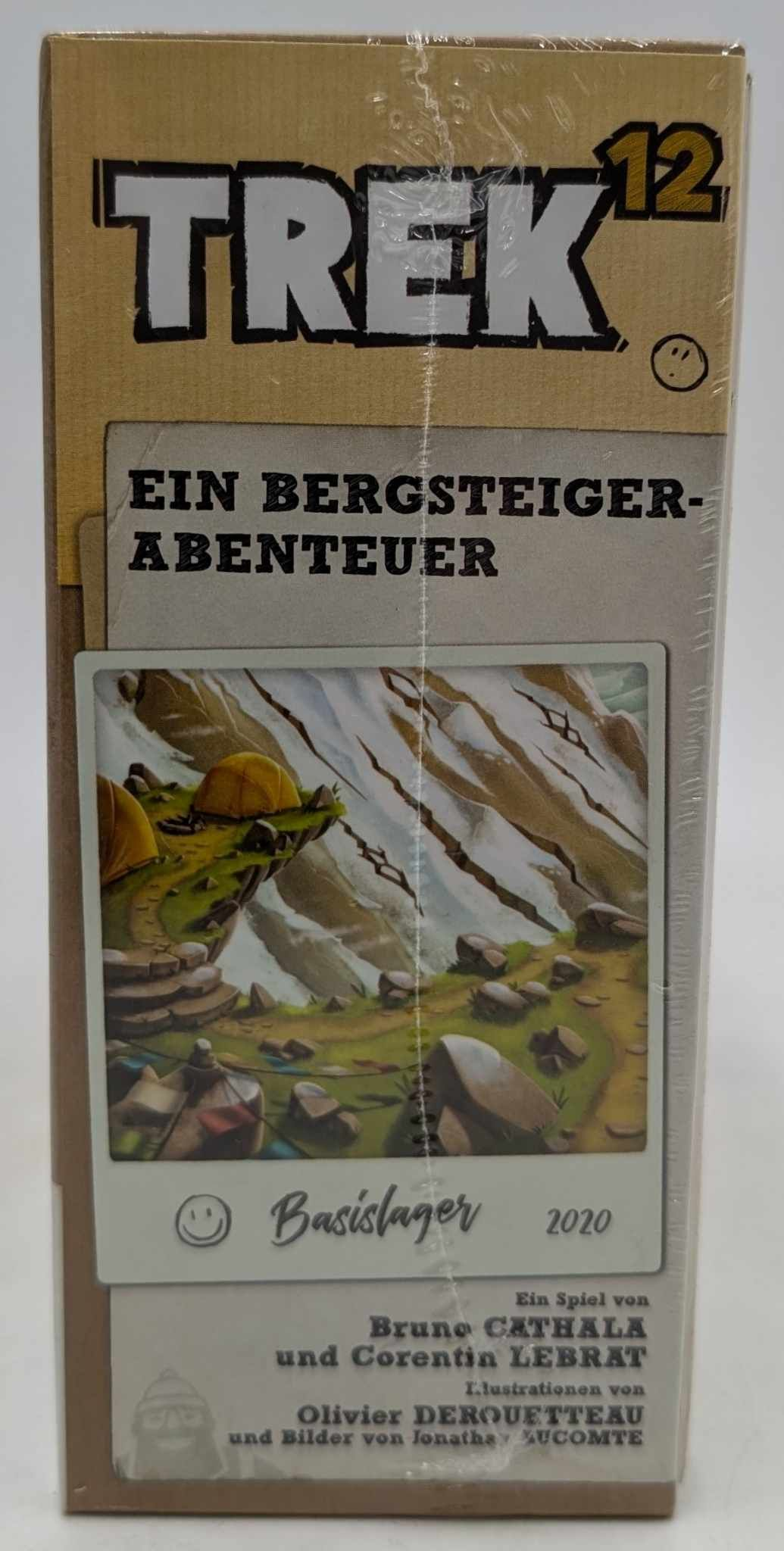 Boîte de jeu Trek 12 avec le sous-titre Ein Bergsteigerabenteuer et une illustration de paysage de montagne.