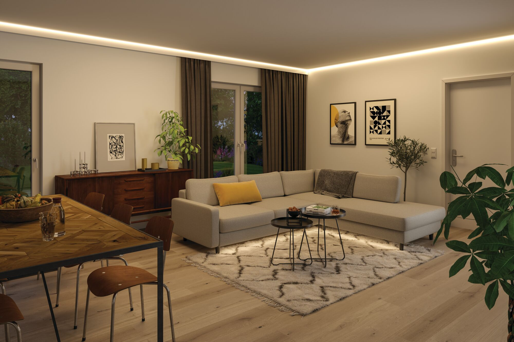 Nowoczesny salon i jadalnia z jasną sofą, drewnianym stołem, wzorzystym dywanem i stylowym wystrojem.