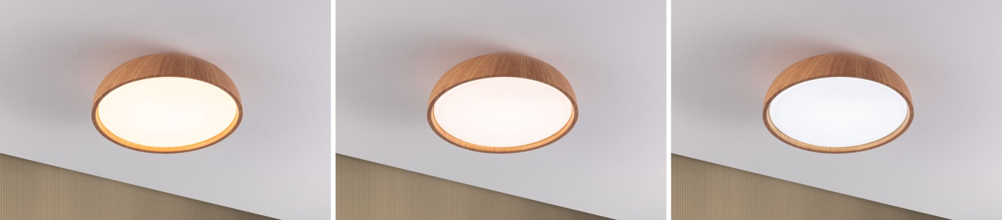 Runde Deckenleuchte aus Holz an weißer Decke zeigt warme bis kühle Lichtfarben.