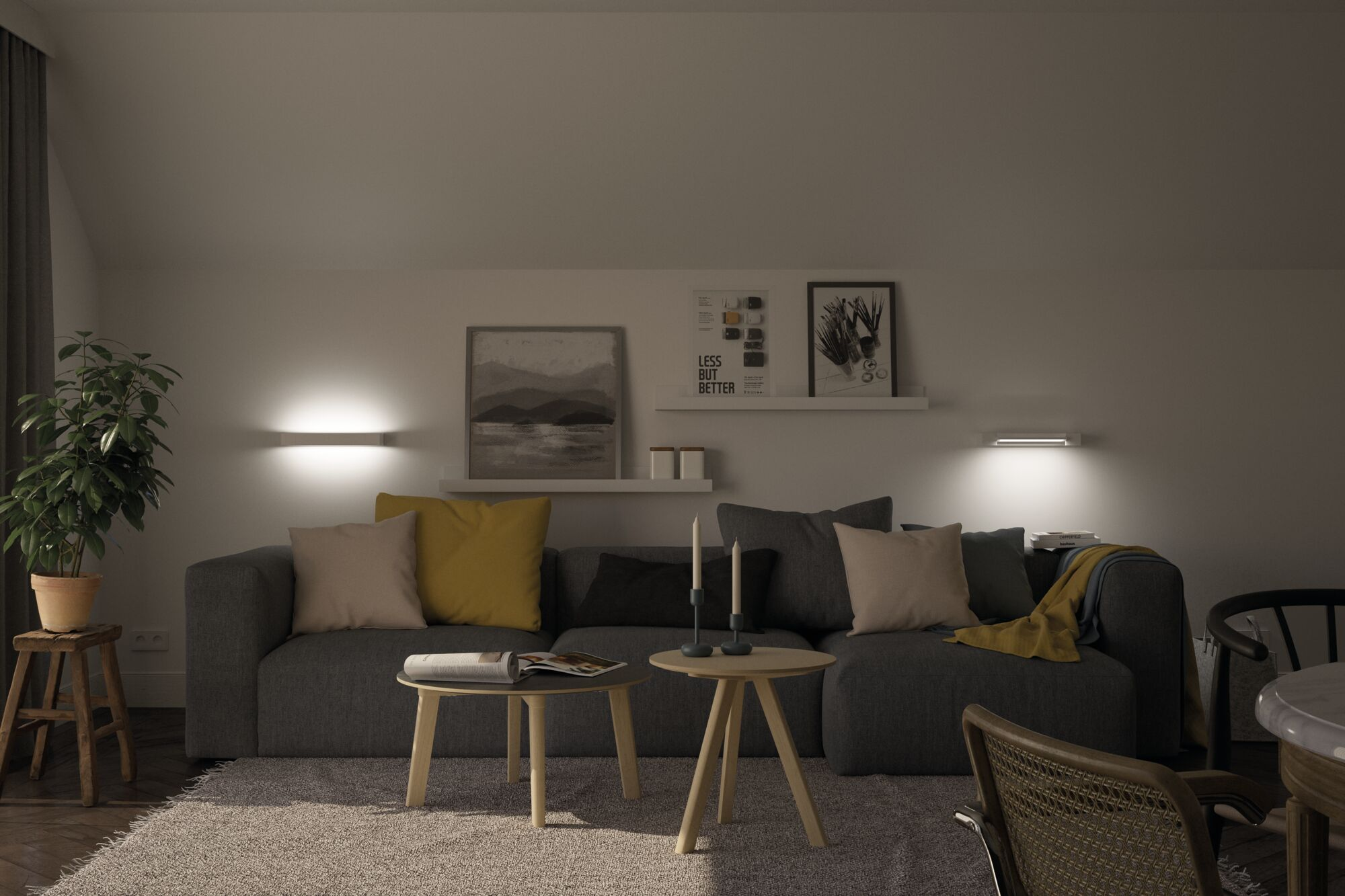 Gemütliches Wohnzimmer mit grauem Sofa, bunten Kissen, kleinen Tischen und Bildern an der weiß beleuchteten Wand.