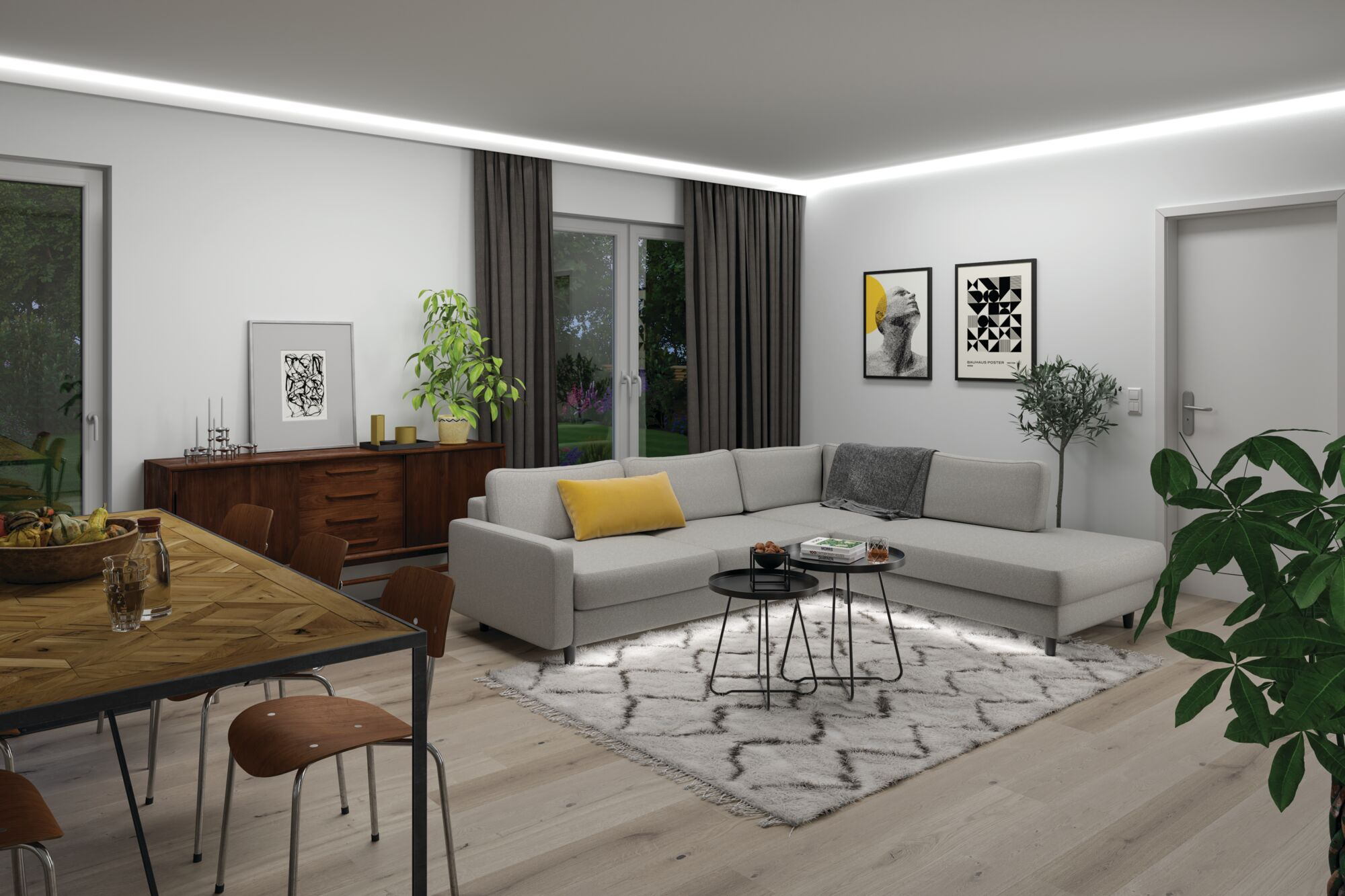 Nowoczesny salon z szarą kanapą narożną, drewnianym stołem, dywanem i roślinami.