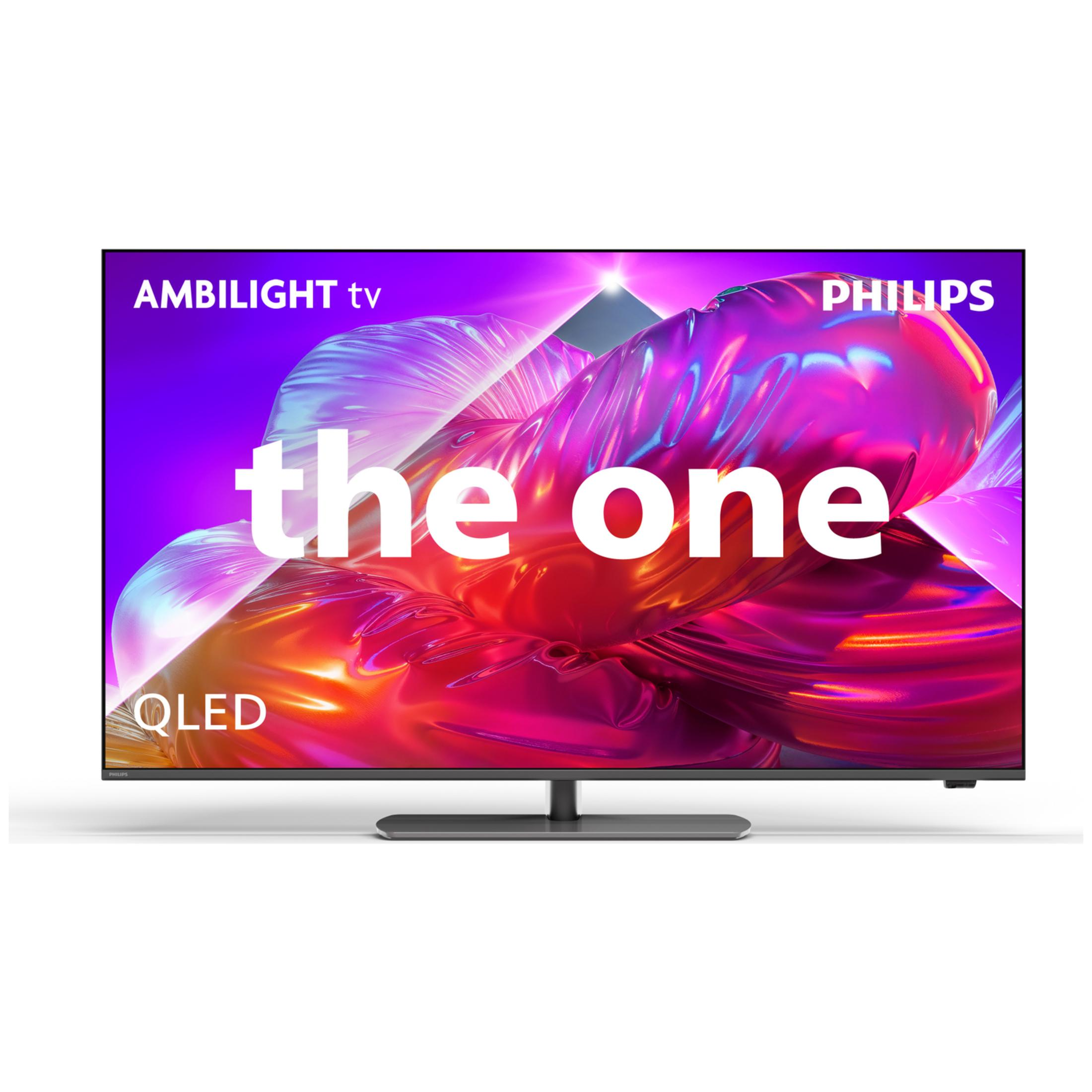 Telewizor Philips Ambilight wyświetla abstrakcyjną grafikę z napisem "the one" i "QLED" na białym tle.