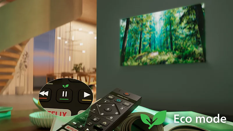 Pilot z trybem eco i ikoną liścia przed telewizorem z obrazem lasu.