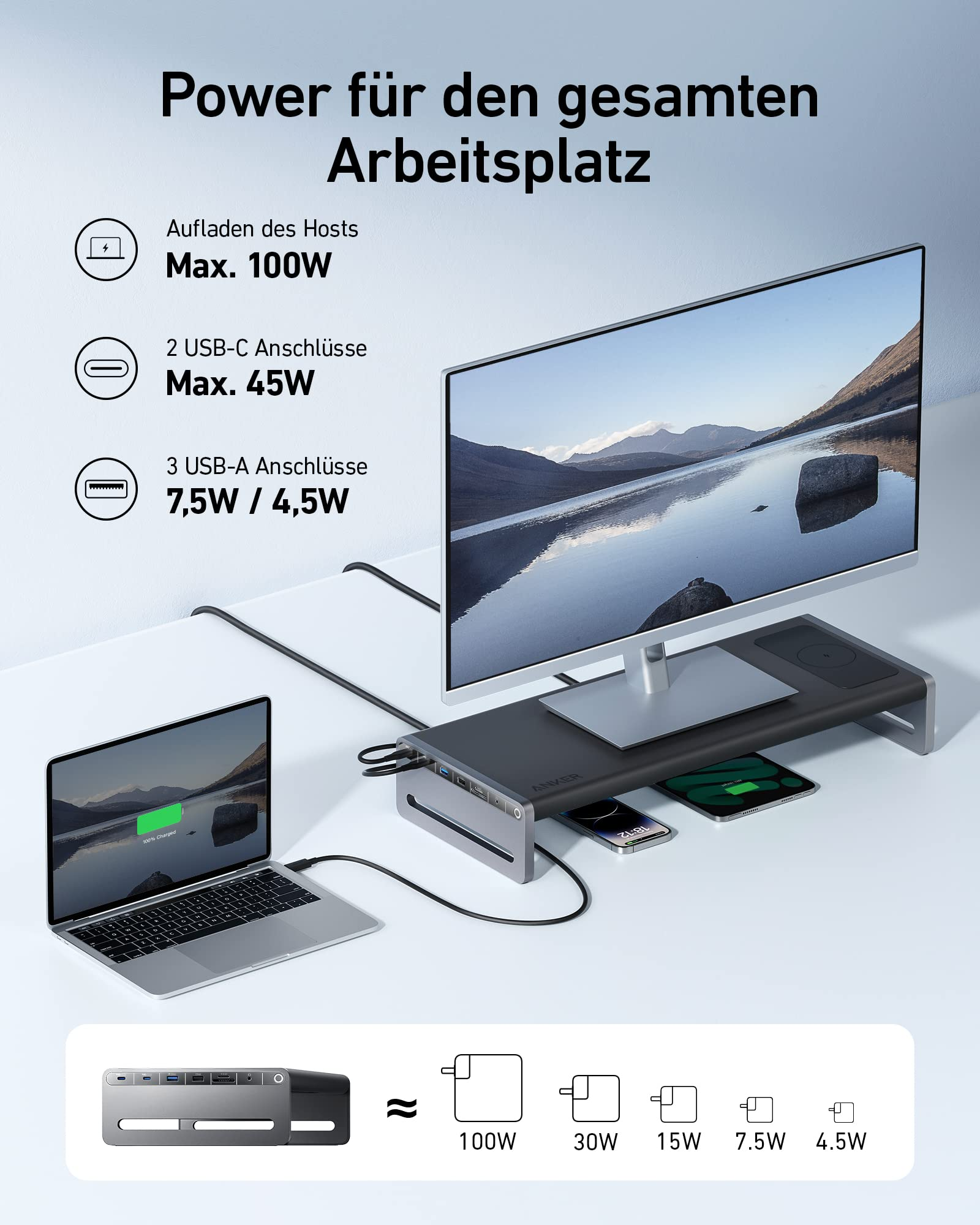 Un supporto per monitor con funzioni di ricarica e un laptop collegato su una scrivania.